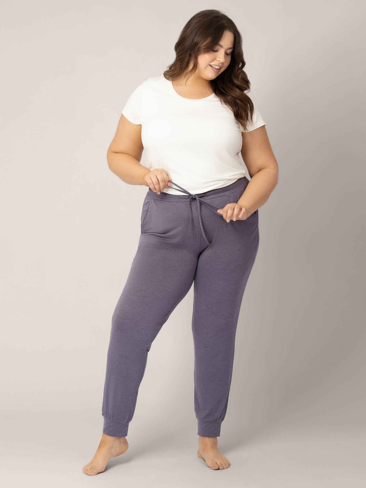 Model wearing the Everyday Lounge Jogger in Heathered Granite @model_info:Bailey is 5'11" and is wearing a 1X Long.