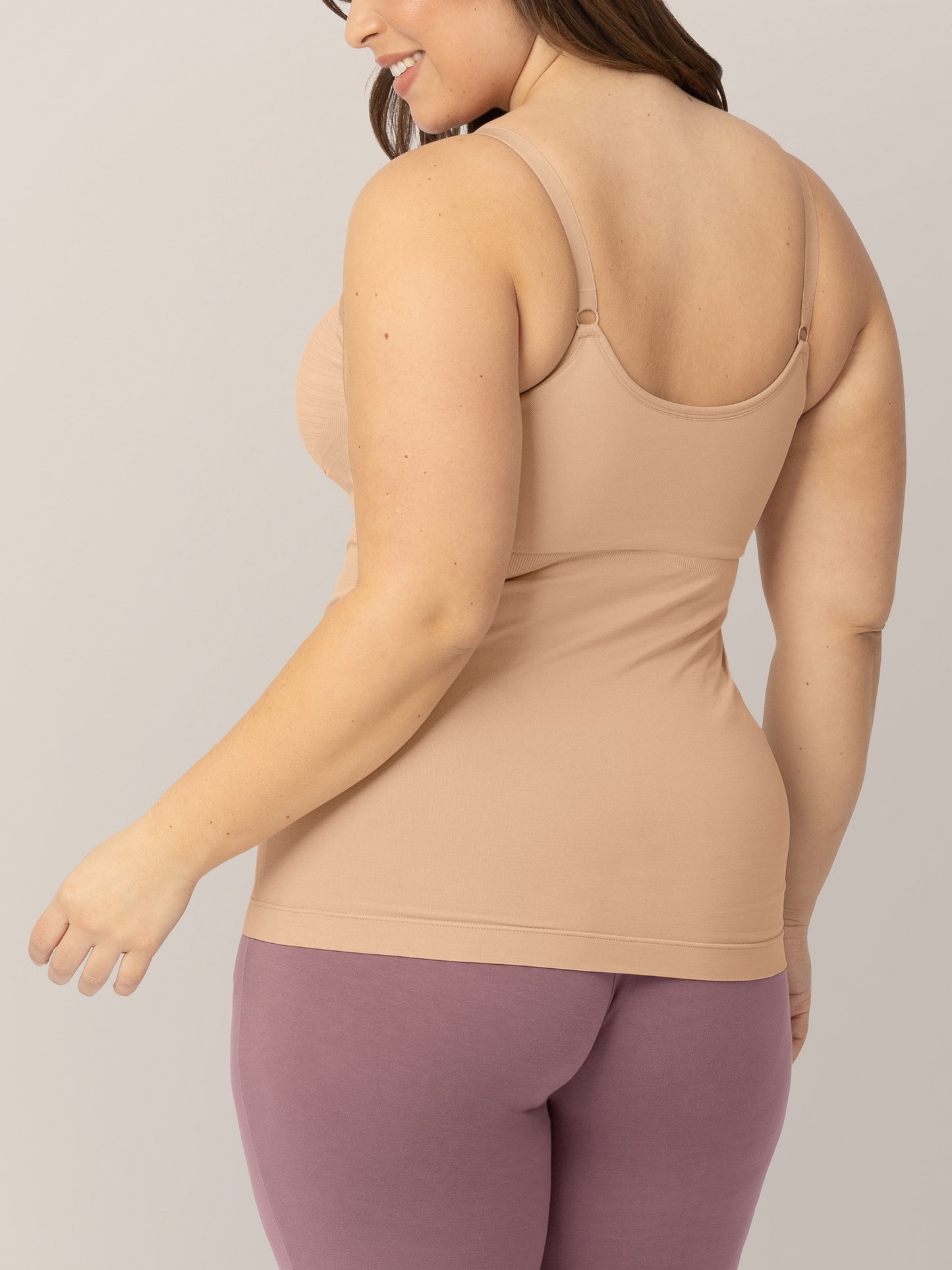 Back of a model wearing the Sublime® Hands-Free Pumping & Nursing Tank in Beige