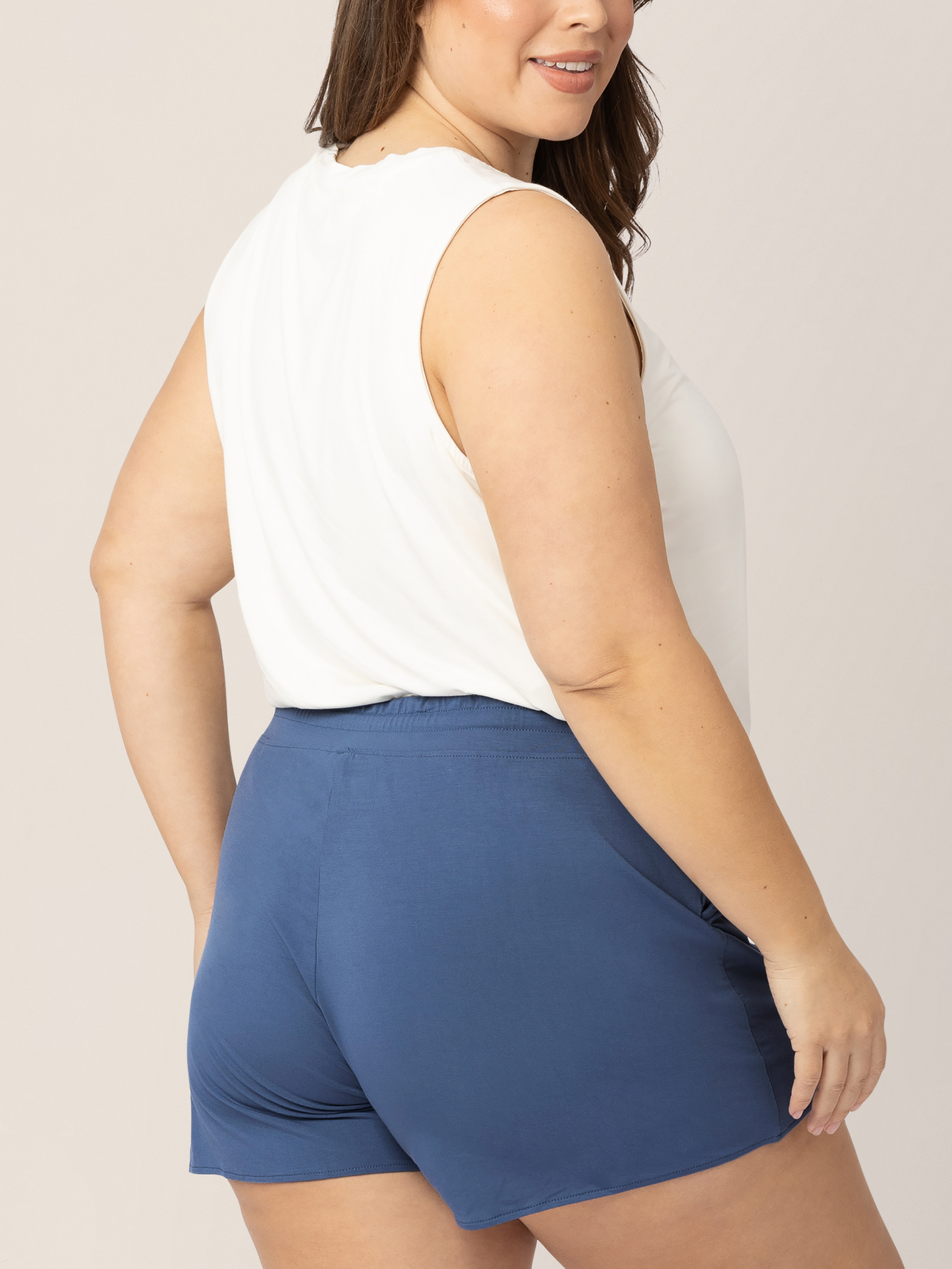 Back view of a model wearing the Bamboo Maternity & Postpartum Lounge Short in Slate Blue