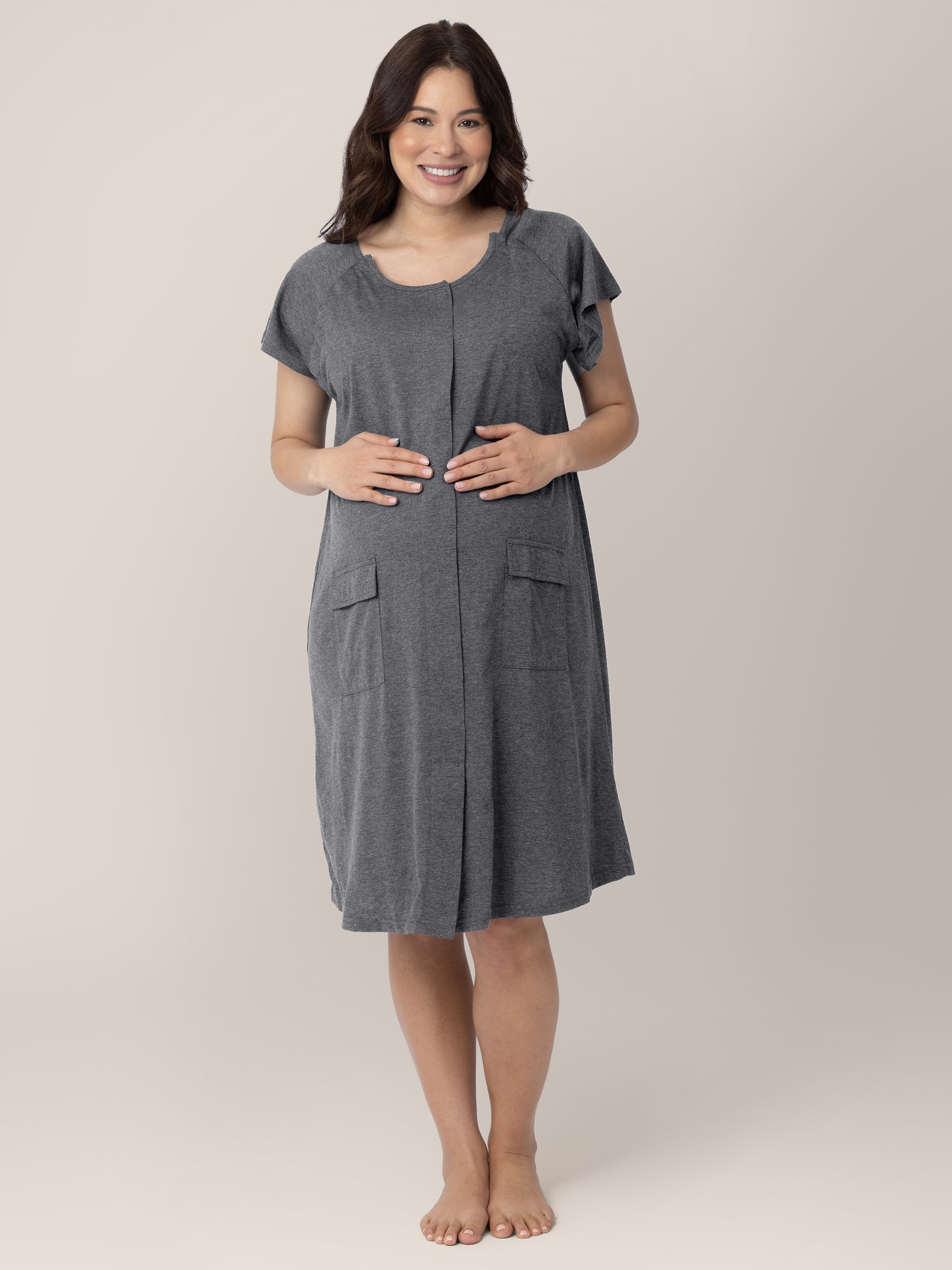 Front view of a pregnant model wearing the Universal Labor & Delivery Gown in Grey Heather