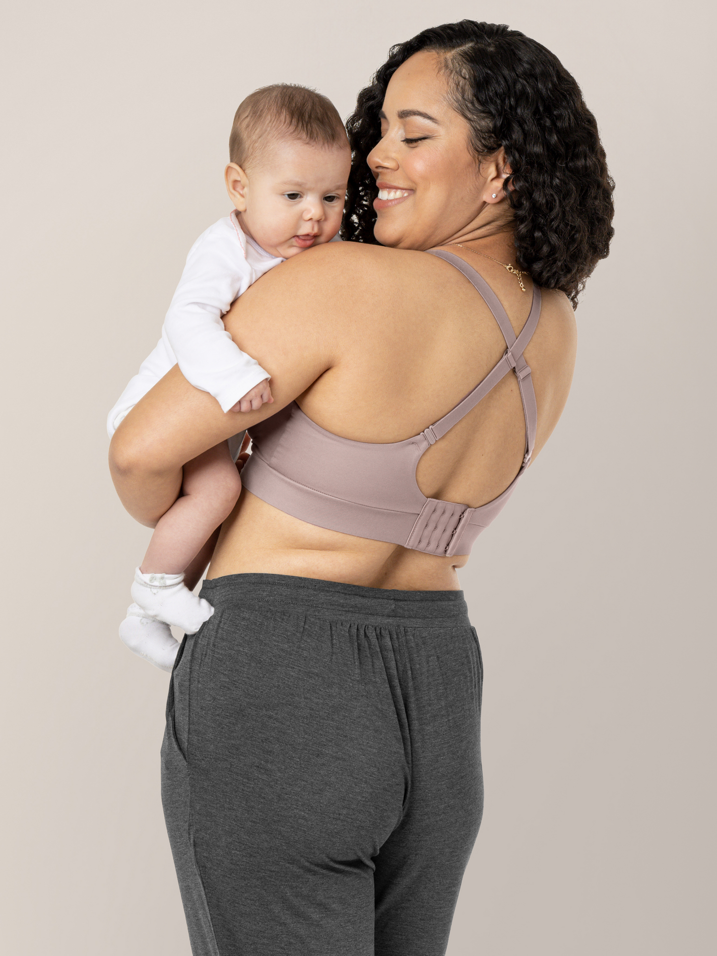 Back view of a model wearing the Minimalist Maternity & Nursing Bra in Lilac Stone.