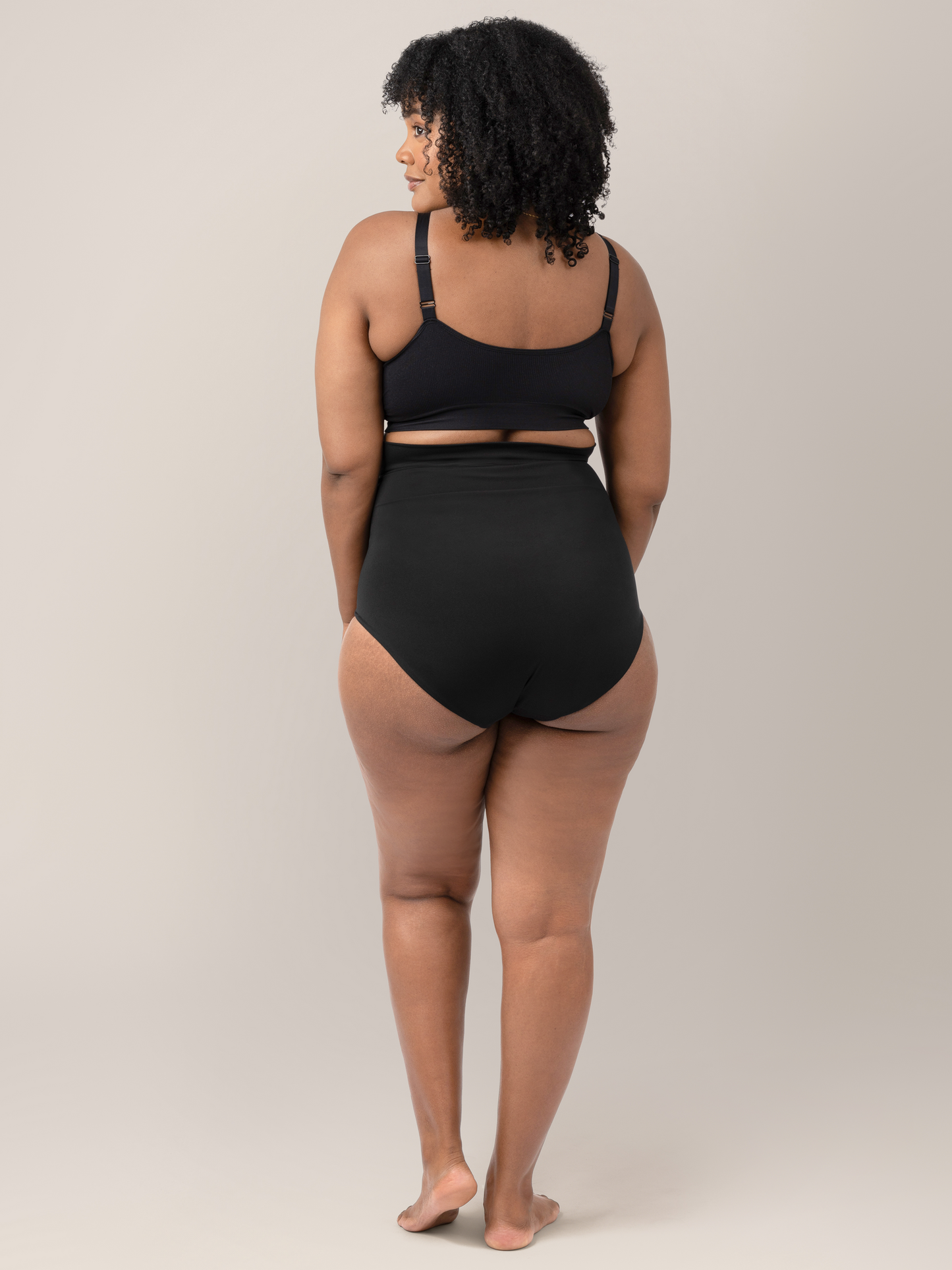Back of a model wearing the Soothing Fourth Trimester Underwear in Black.