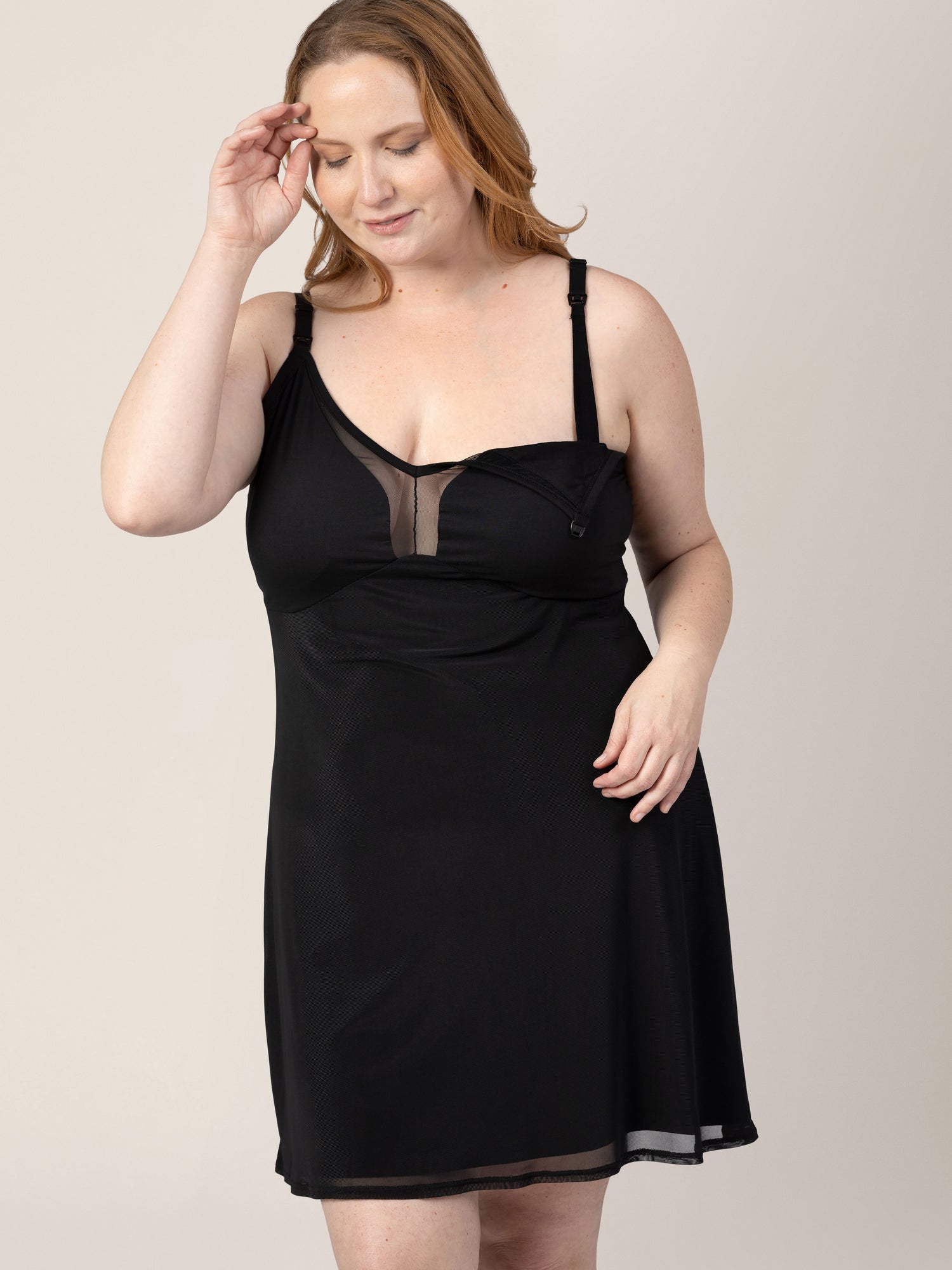 Model wearing the Aurora Mesh Nursing Nightgown in Black, with the clip down nursing access engaged. 