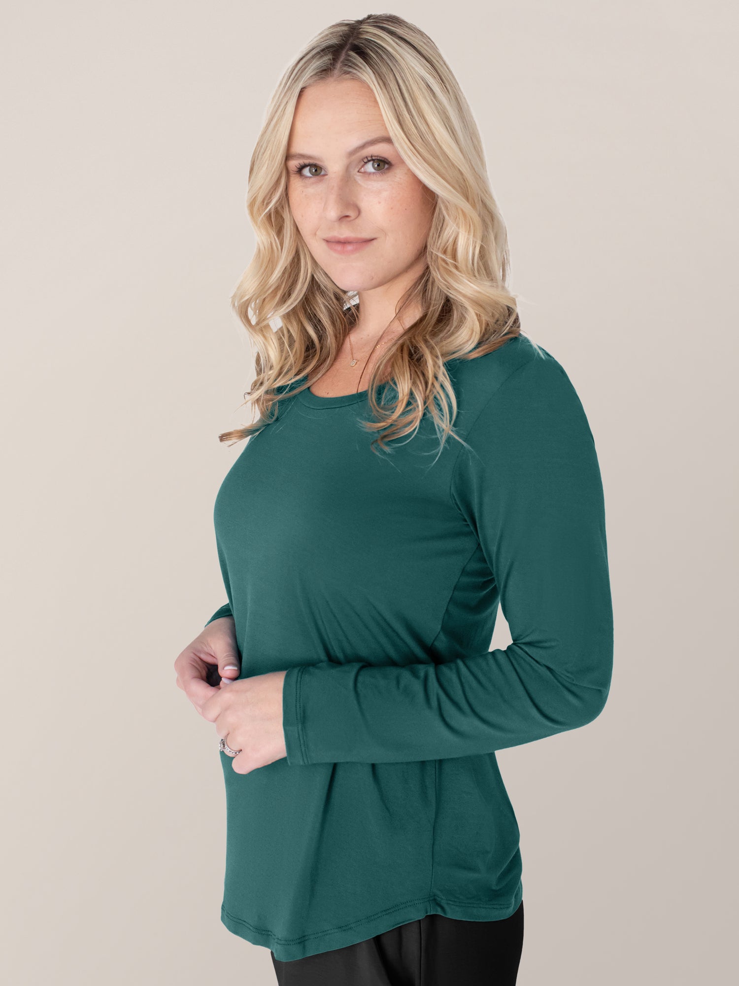 Side view of a model wearing the Bamboo Maternity & Nursing Long Sleeve T-shirt in Evergreen
