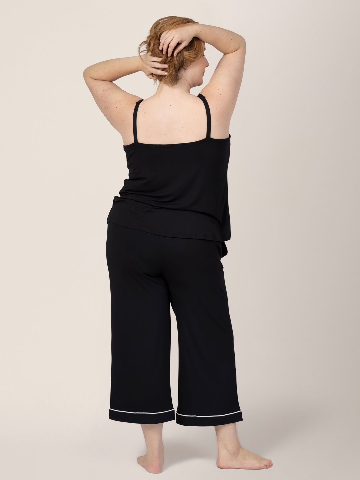 Back view of model wearing Clea Bamboo Nursing Tank & Capri Pajama Set in Black
