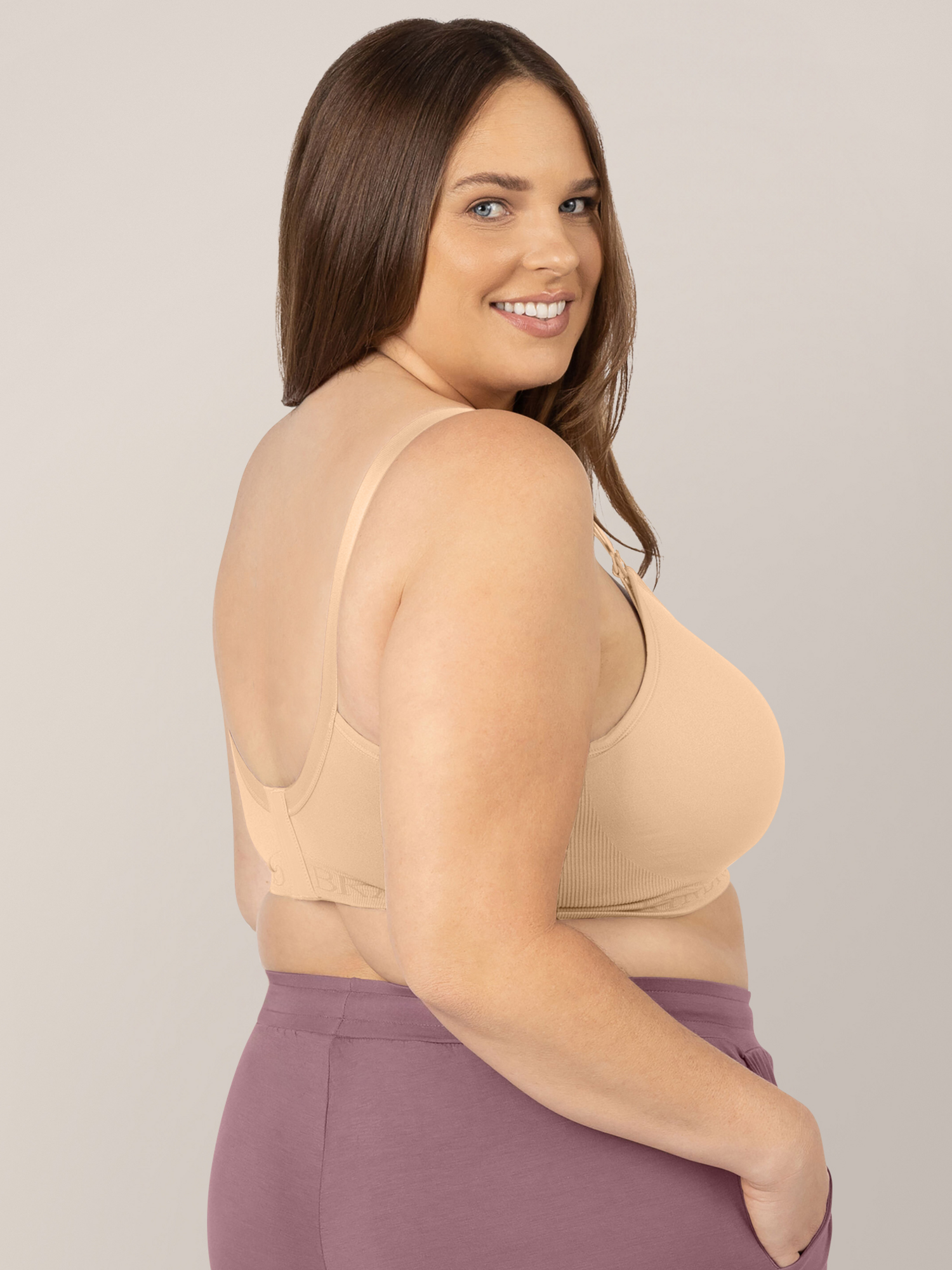 Back of a model wearing the Signature Sublime® Contour Maternity & Nursing Bra in Beige