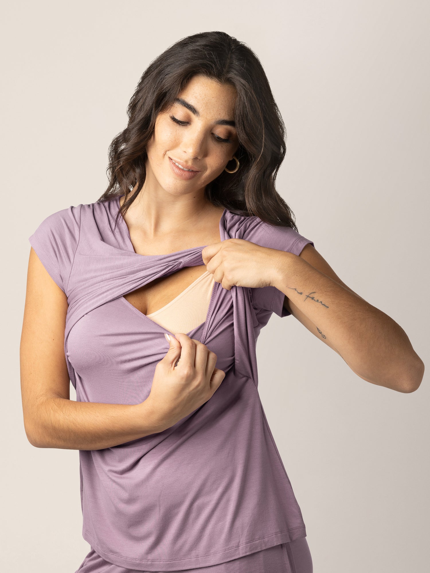 Closeup of a model wearing the Davy Maternity & Nursing Pajama Set in Dusty Mauve, showing the easy pull up nursing access