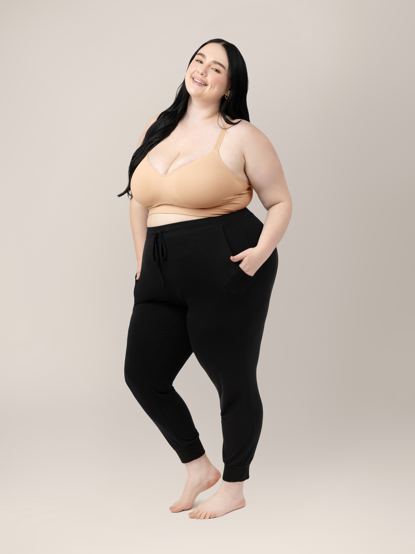 Model wearing the Everly Wireless Contour Bra  with her hands in her pockets.