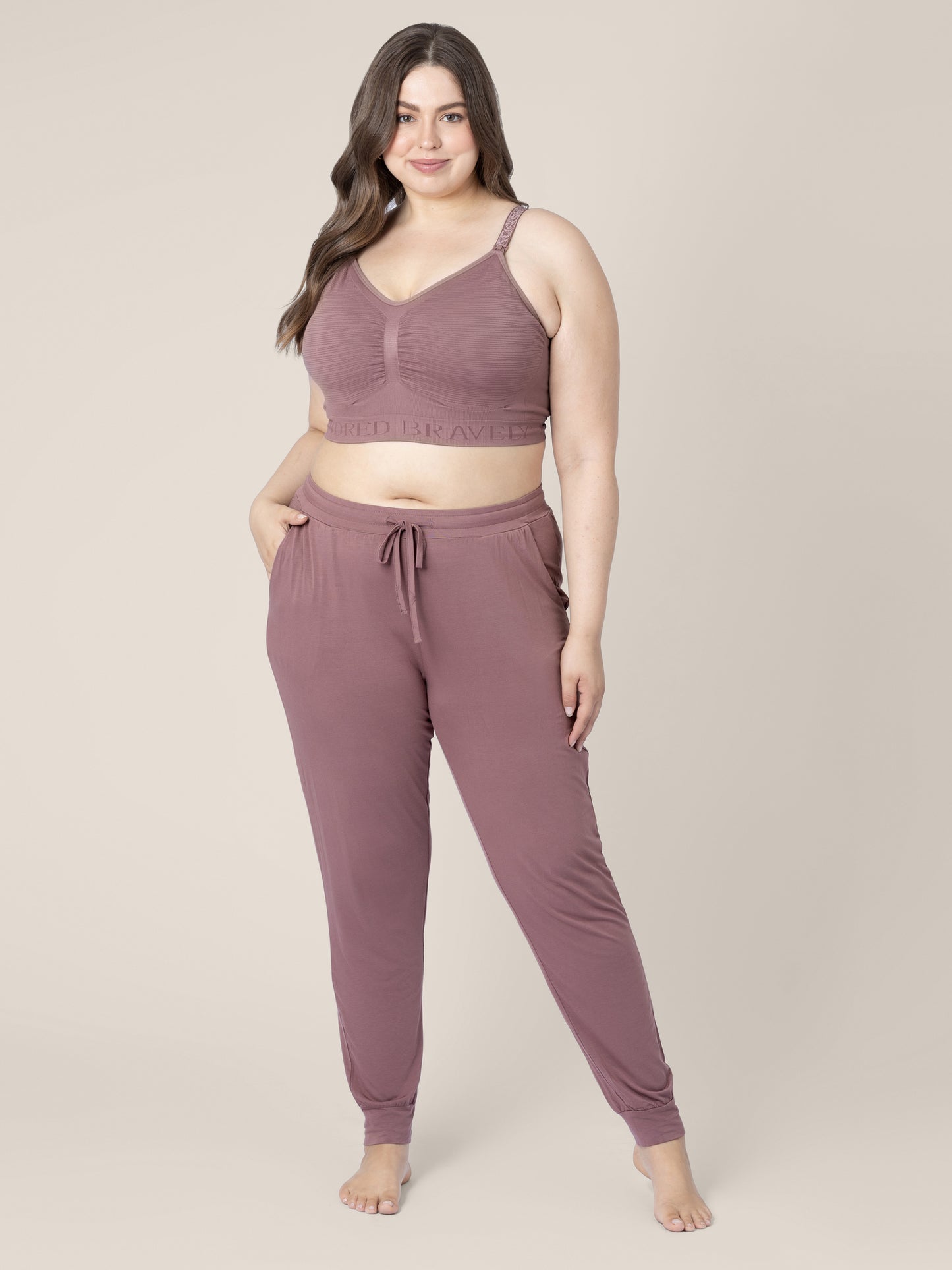 Front view of a model wearing the Everyday Lounge Jogger in Twilight with a matching Bra. @model_info:Bailey is 5'11" and is wearing a 1X Long.