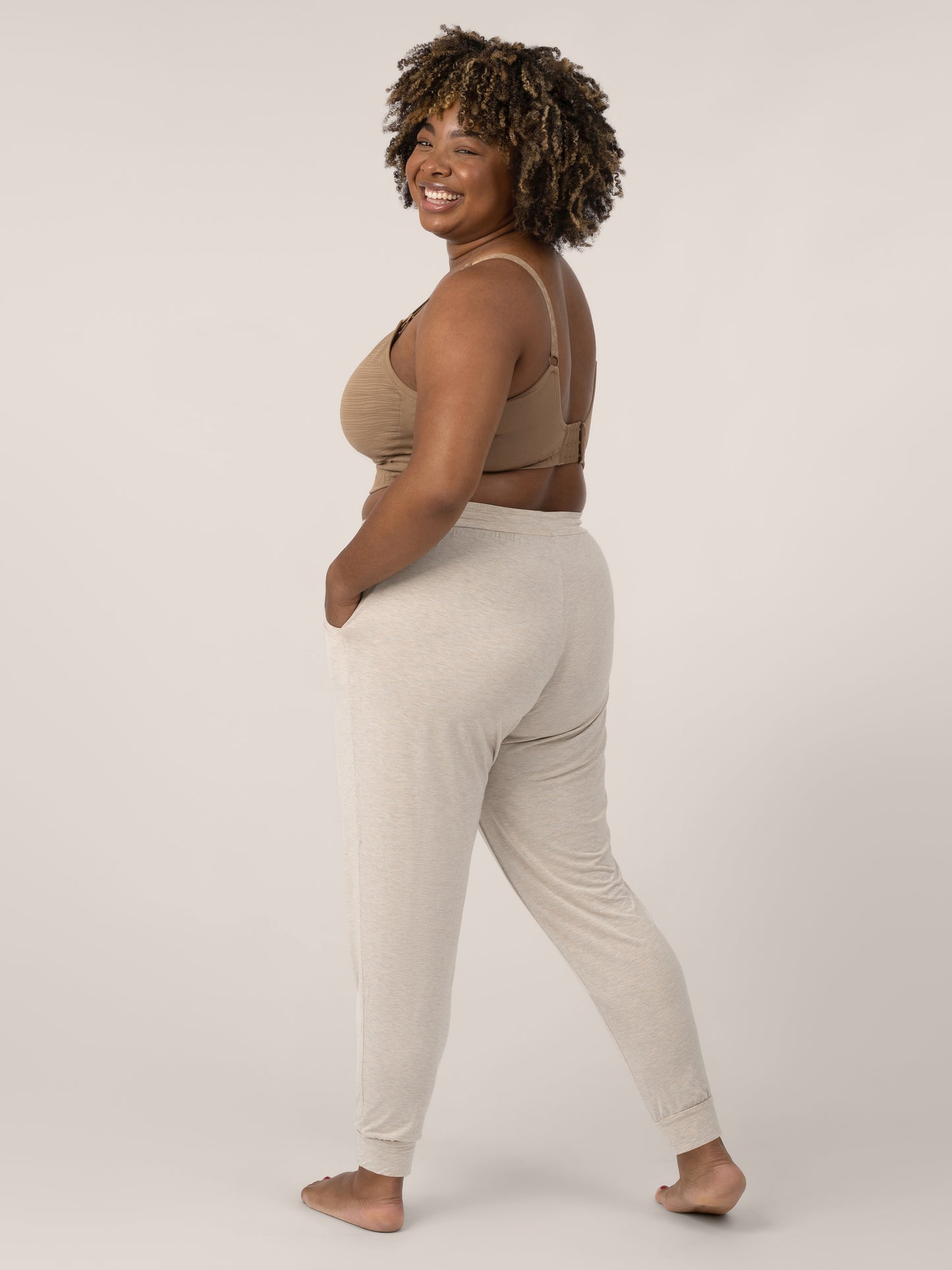 Model wearing the Everyday Lounge Jogger in Oatmeal Heater @model_info:Skye is 5'7" and is wearing an X-Large Long.