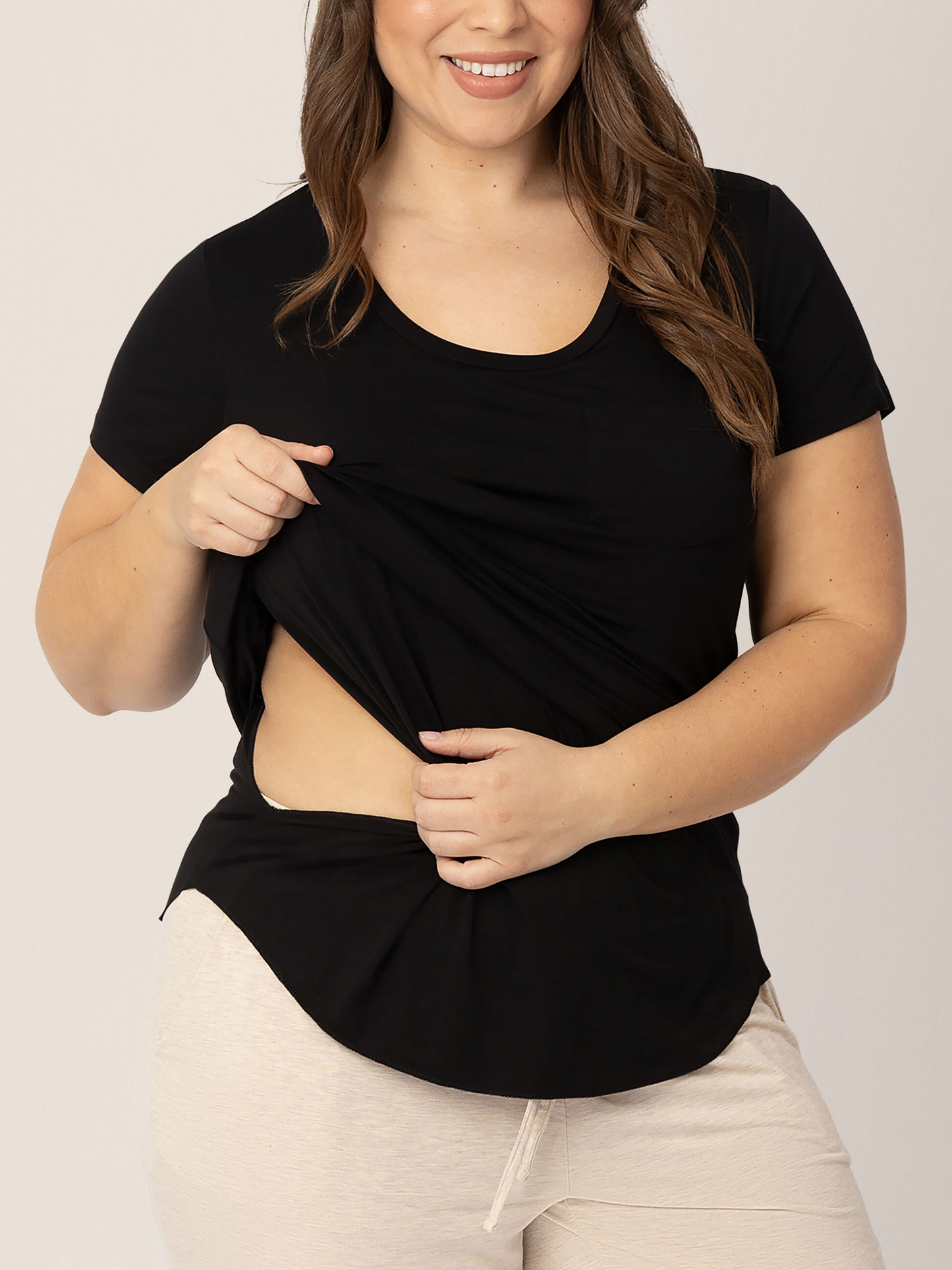 Model wearing the Everyday Maternity & Nursing T-shirt in Black with a pocket showing the nursing panel.