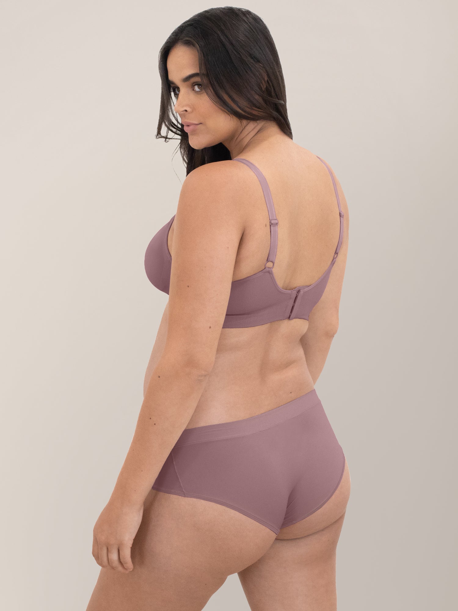 Back view of a model wearing the Grow with Me™ Maternity & Postpartum Hipster in Twilight