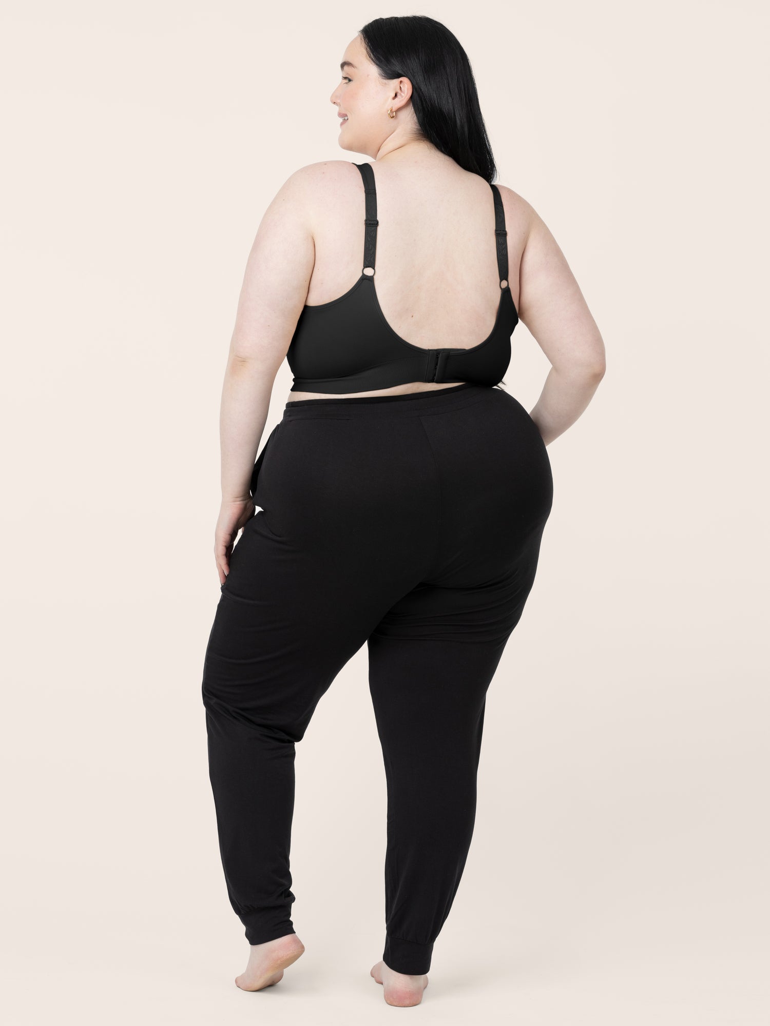 Back view of a model wearing the Nellie Sublime® Wireless Bra in Black