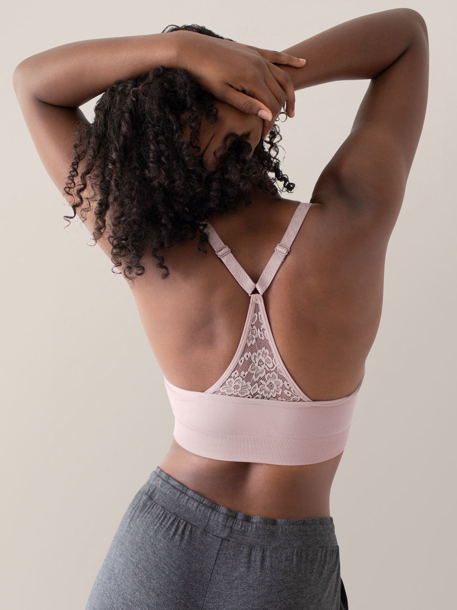 Back view of a model wearing the Nellie Lace Racerback Wireless Bra in Lily.