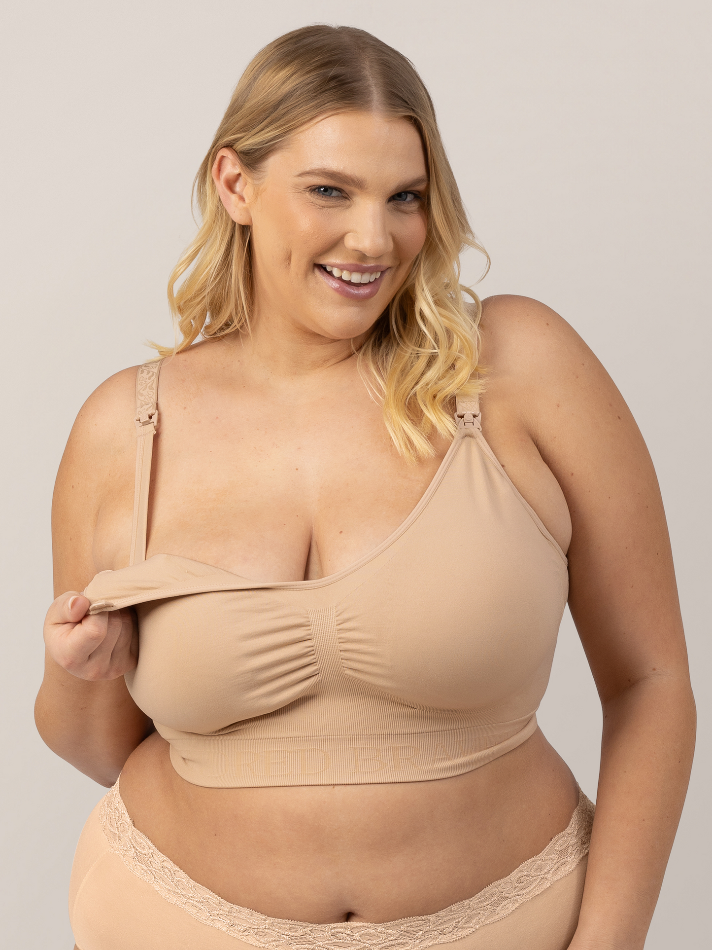 Model showing the easy clip down nursing access on the Simply Sublime® Nursing Bra in Beige