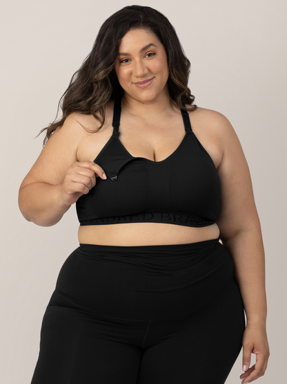Model showing the easy clip down pumping access on the Sublime® Hands-Free Pumping & Nursing Sports Bra in Black