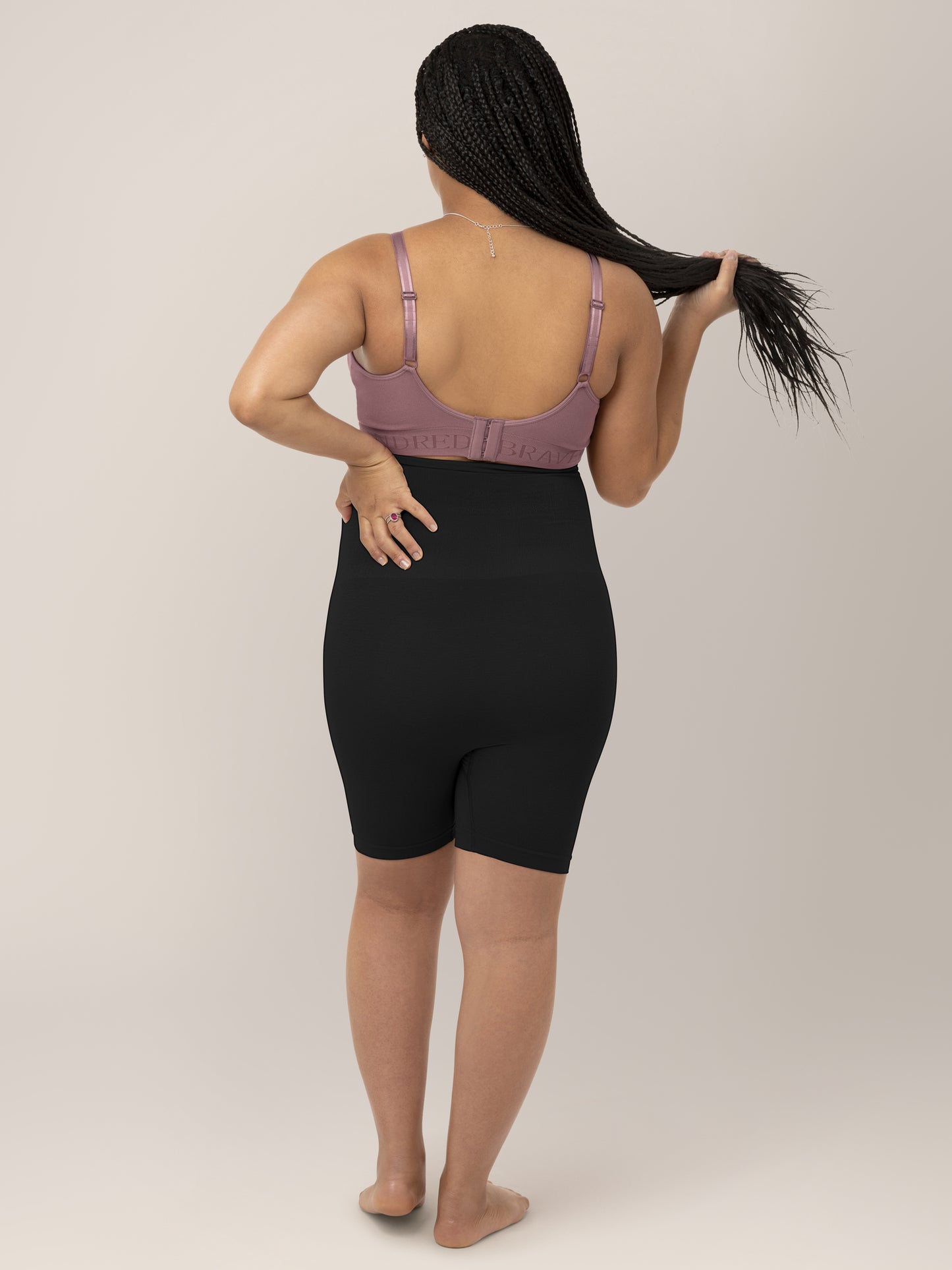 Back view of a model wearing the Seamless Bamboo Maternity Thigh Savers in Black.