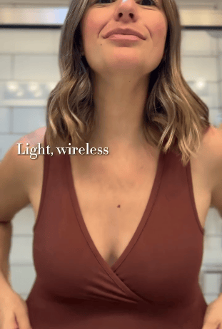 Rotating Gif of woman displaying the soft stretchiness of the French Terry Racerback Nursing & Sleep Bra in Redwood in a bathroom. White text: Ultra Soft, pull-aside nursing access, light, wireless.