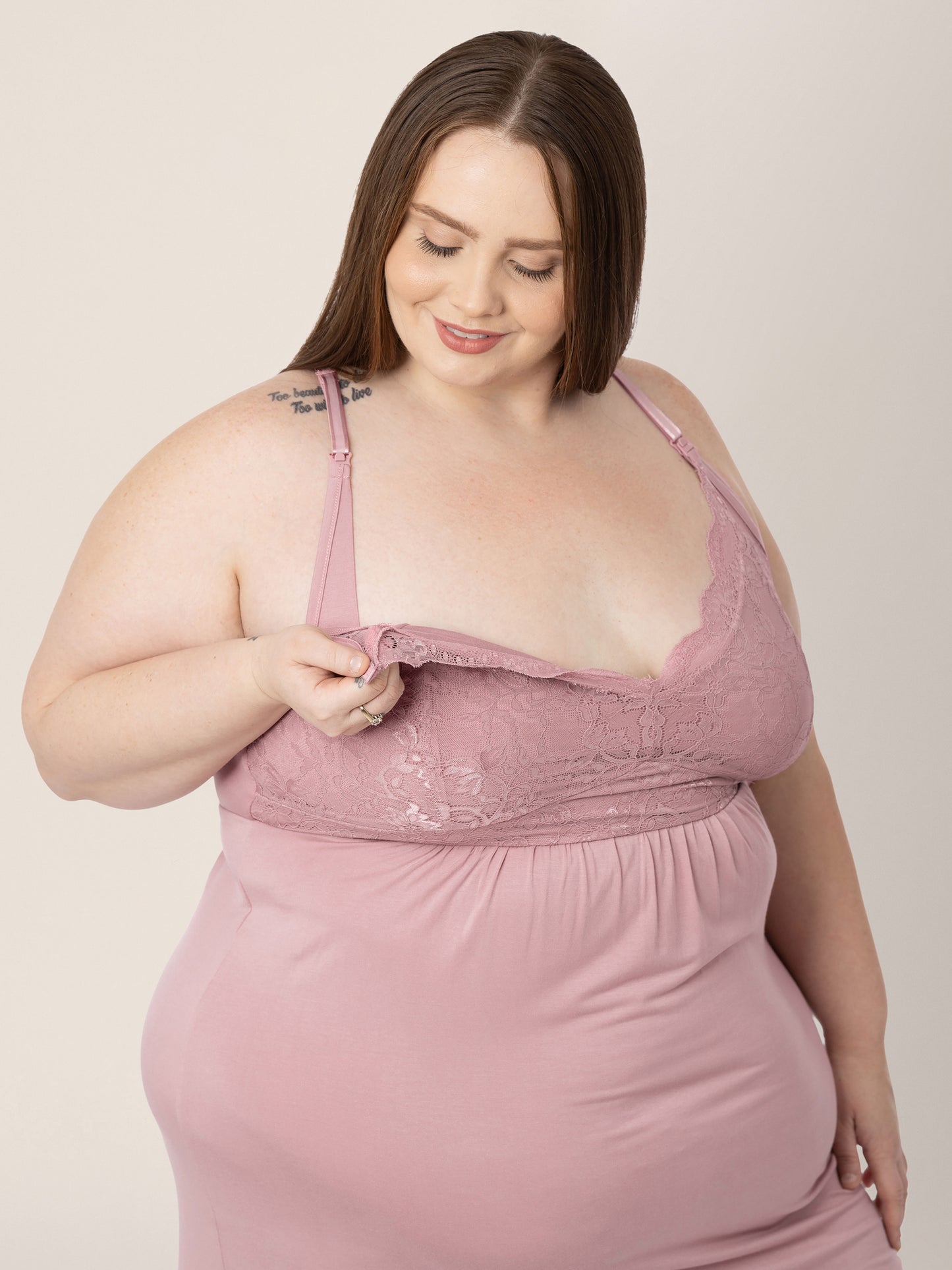Closeup of a model wearing the Lucille Maternity & Nursing Nightgown in Vintage Pink showing the easy clip down nursing access.