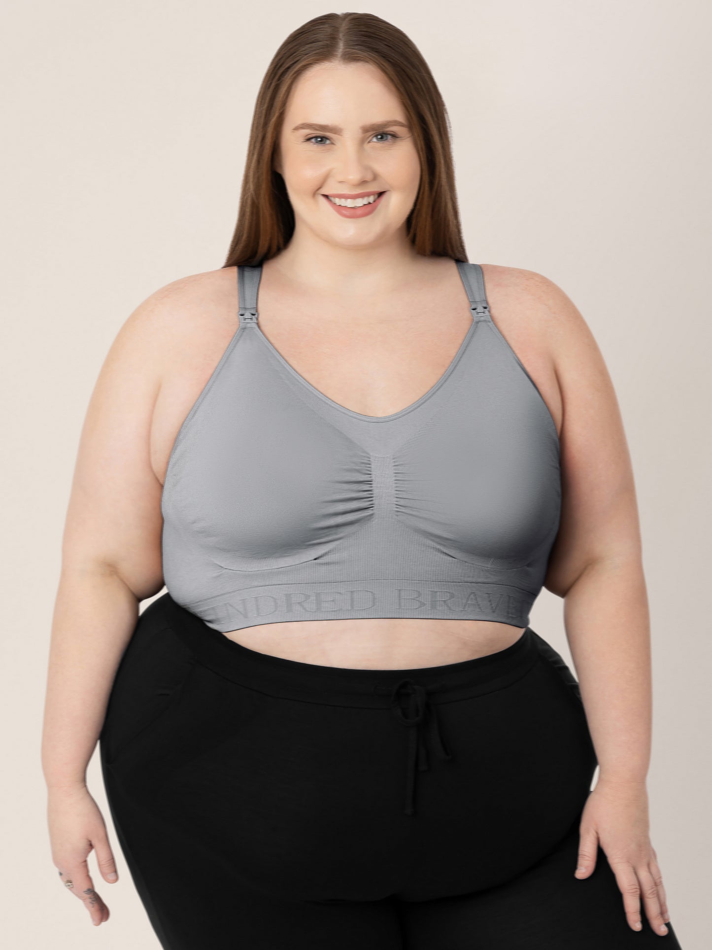 Model wearing the Simply Sublime® Nursing Bra in Grey with her hands on her legs. @model_info:Hayley is wearing a 1X Busty.