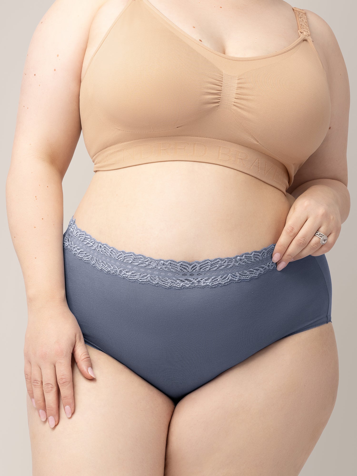 Closeup of a model wearing the High Waisted Postpartum underwear in Dusty Hues. 