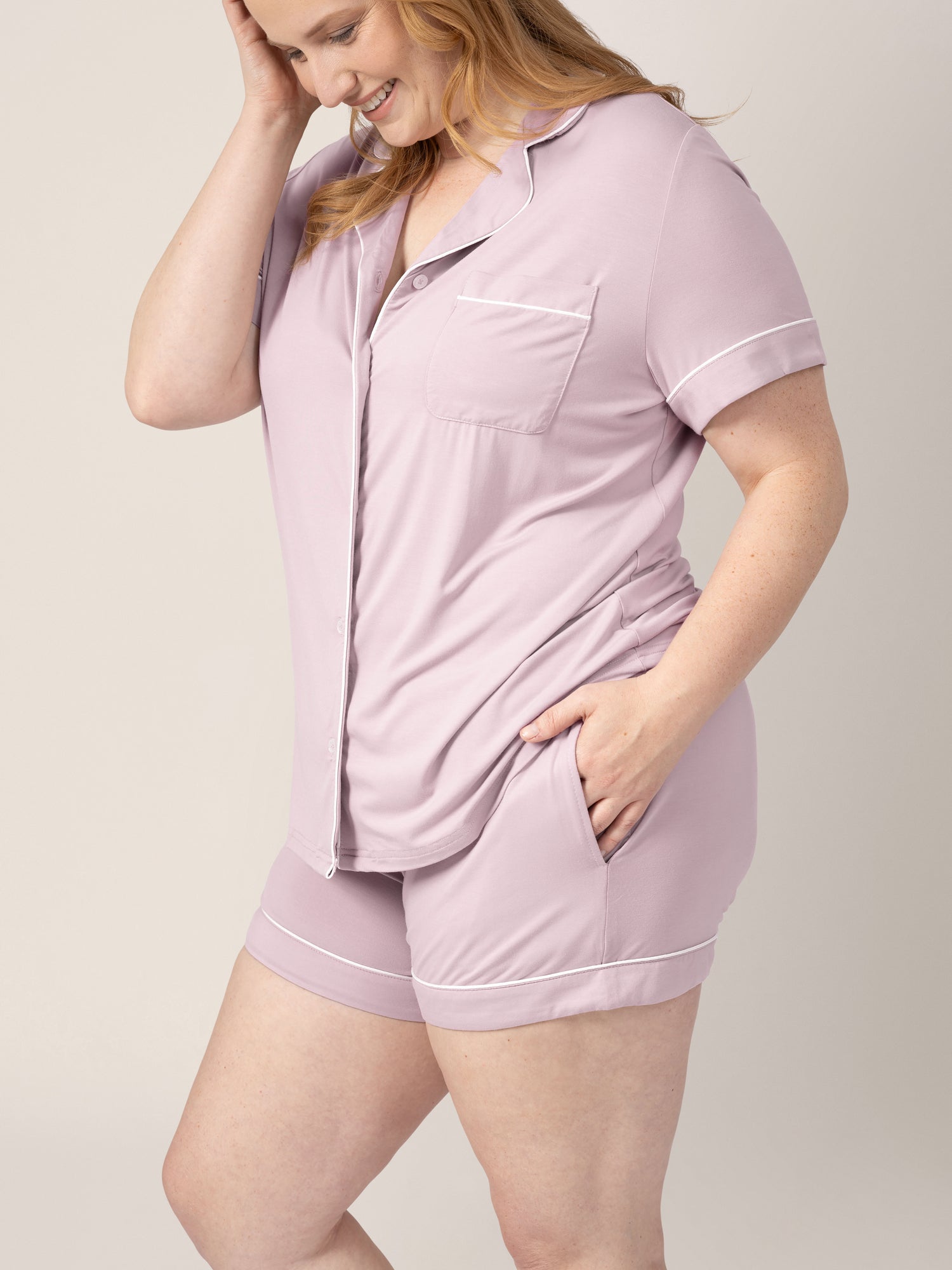 Side view of model wearing the Clea Bamboo Classic Short Sleeve Pajama Set in Lilac, with hand in pocket