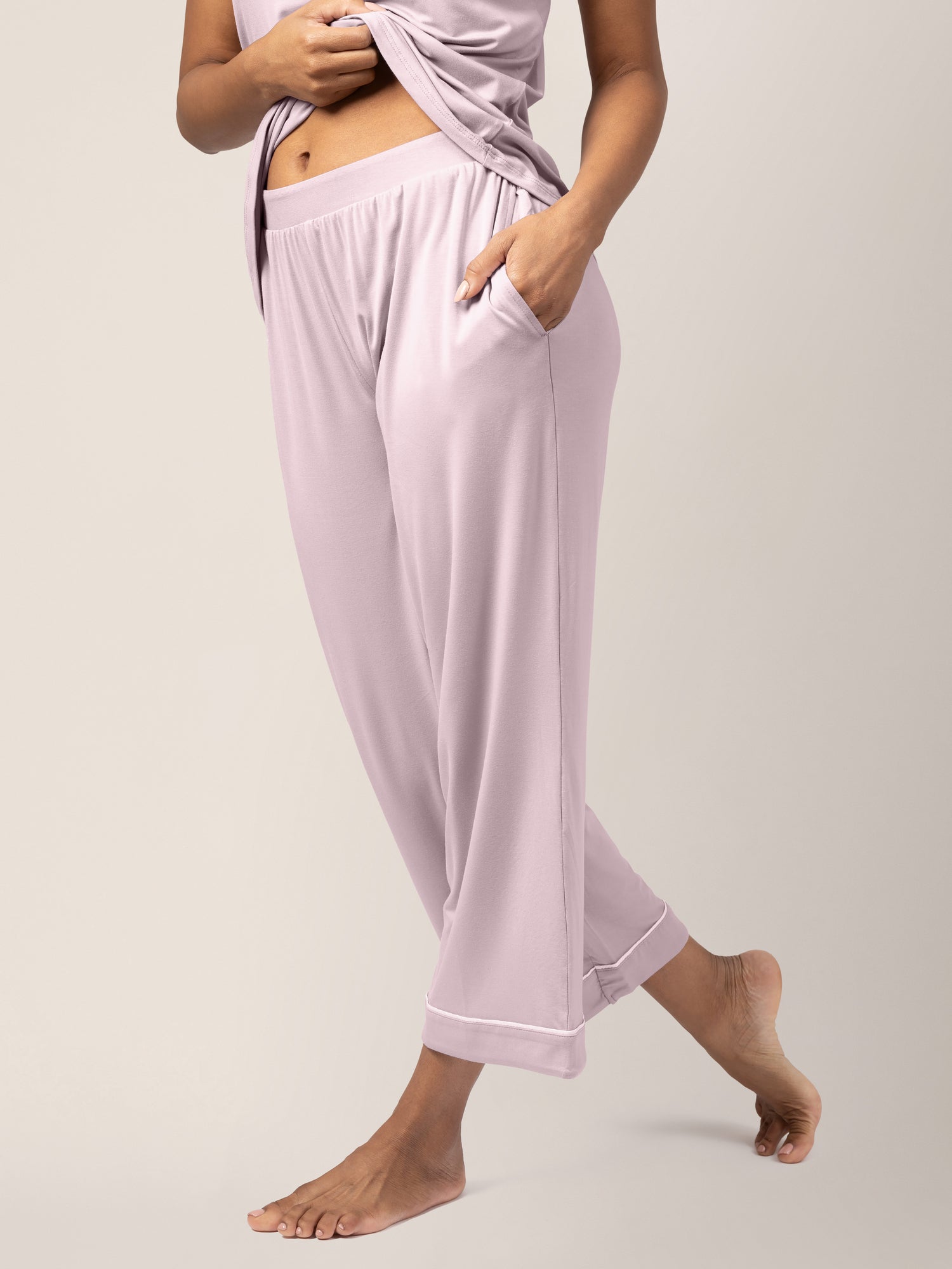 Close-up of waistband on model wearing Clea Bamboo Nursing Tank & Capri Pajama Set in Lilac, with hand in pocket
