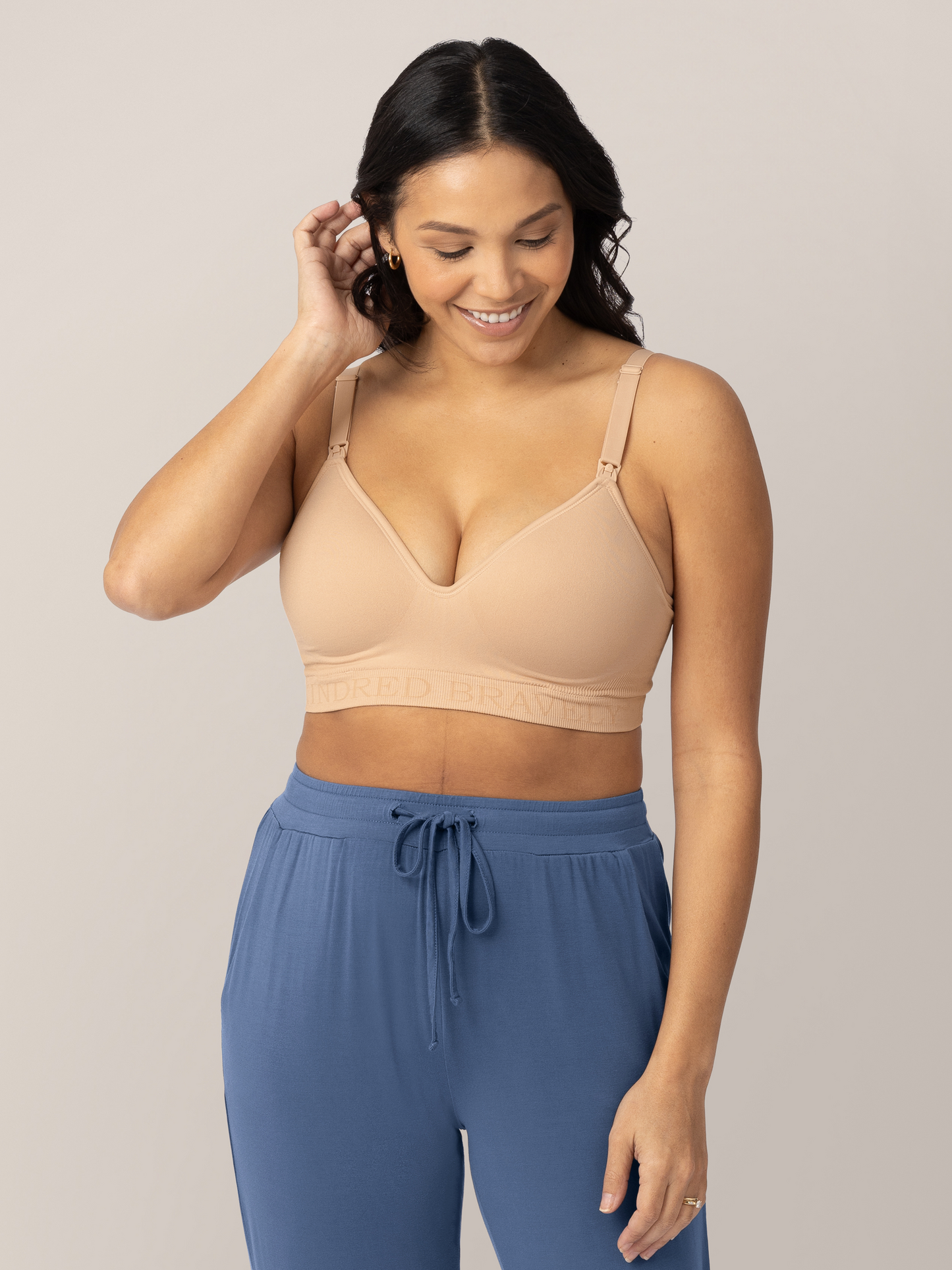 Front view of a model wearing the Signature Sublime® Contour Maternity & Nursing Bra in Beige. 