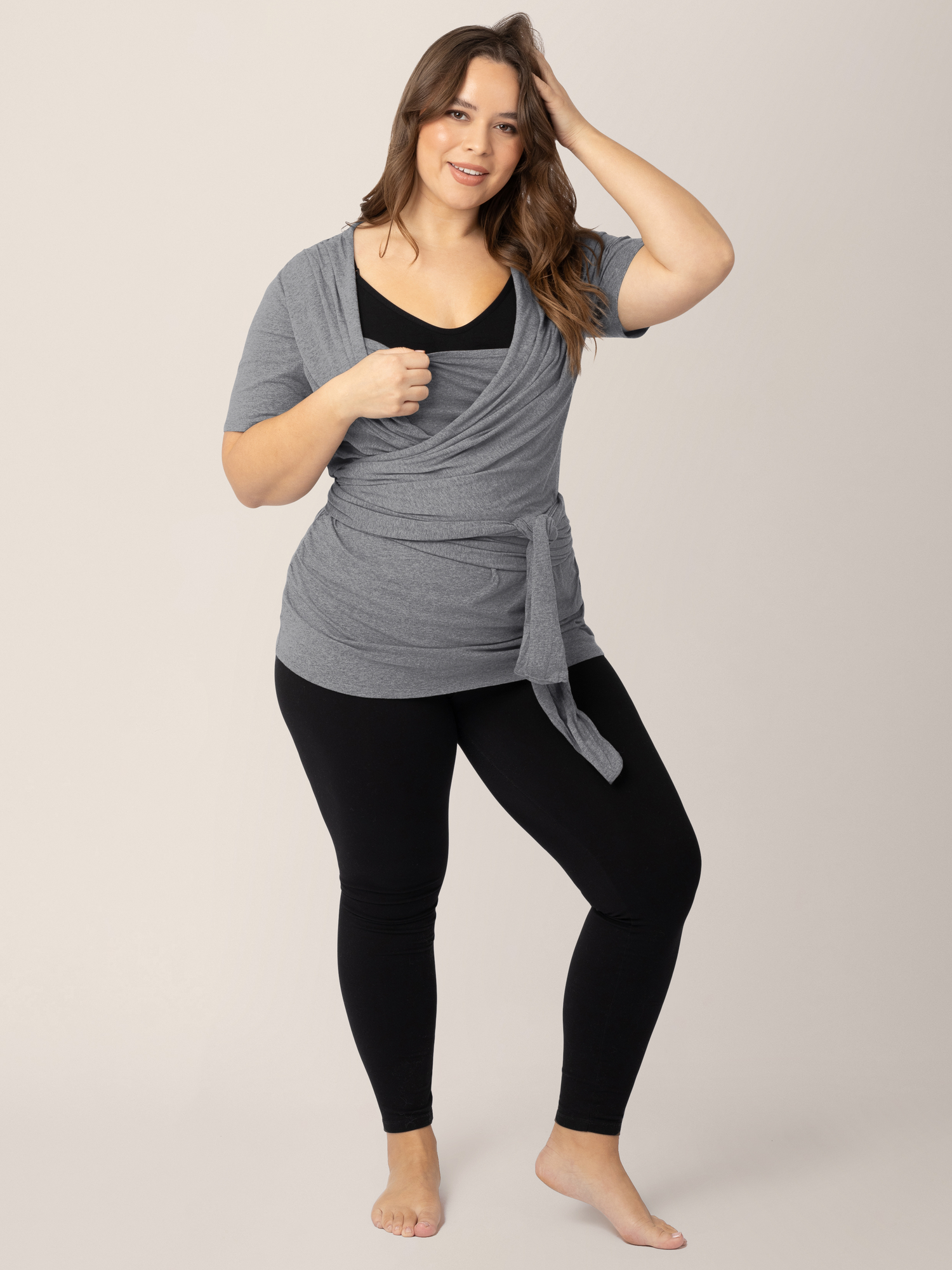 Model wearing the Organic Cotton Skin to Skin Wrap Top in Charcoal Grey Heather showing the easy pull down wrap neck.