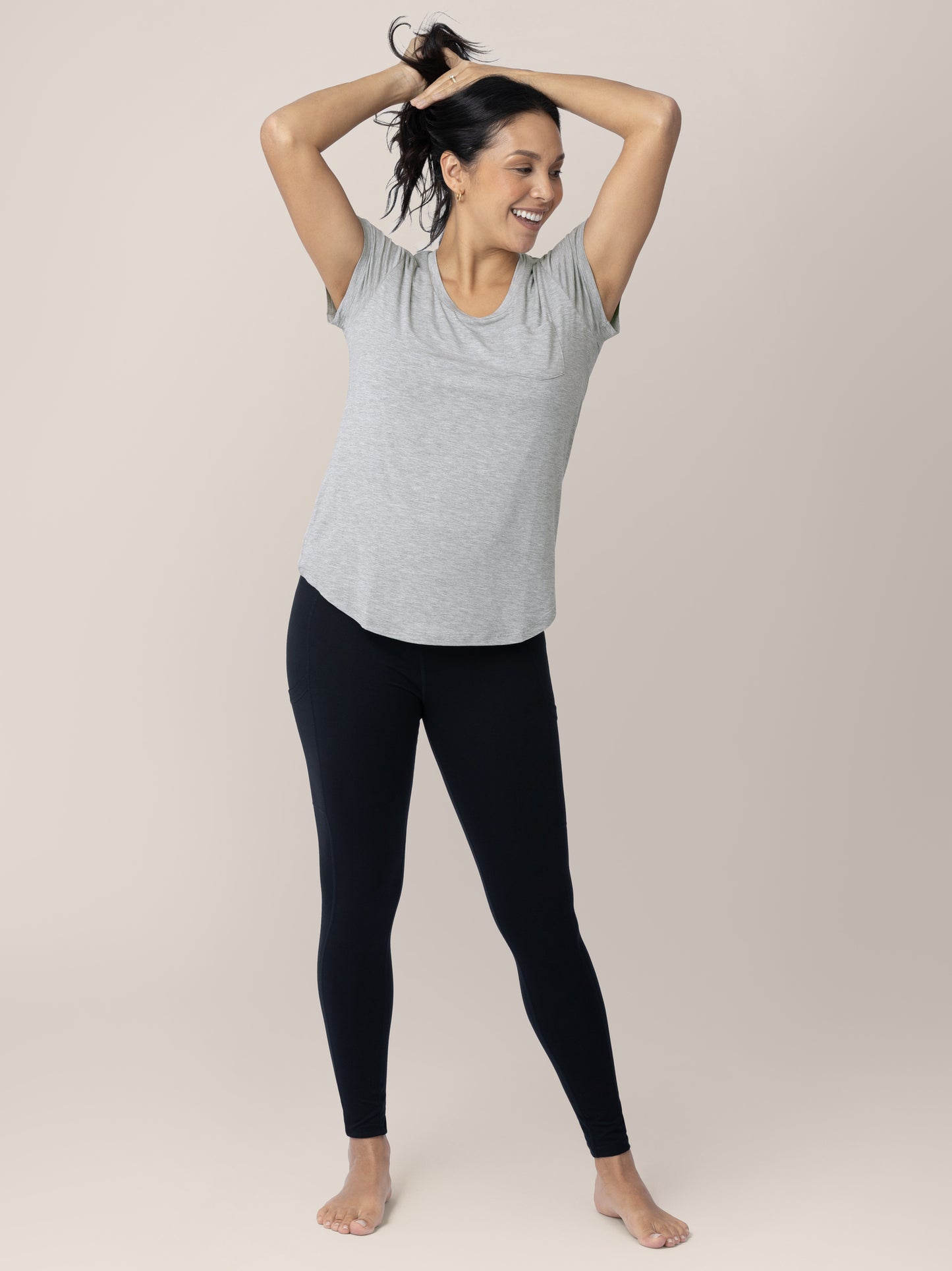 Model holding back her hair while wearing the Everyday Maternity & Nursing T-shirt in Grey Heather