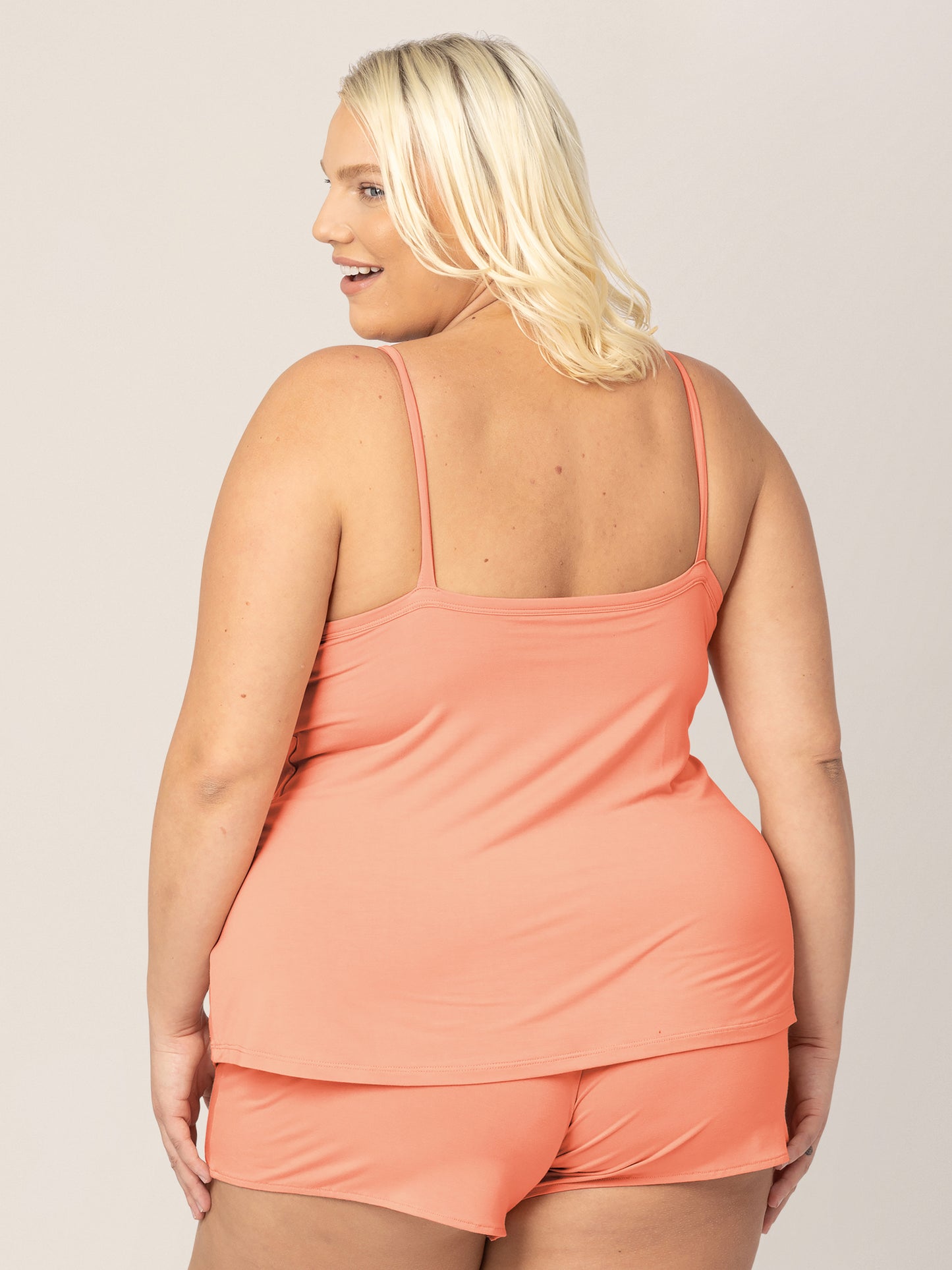 Back view of model wearing the Bamboo Lounge Around Nursing & Maternity Tank in vintage coral