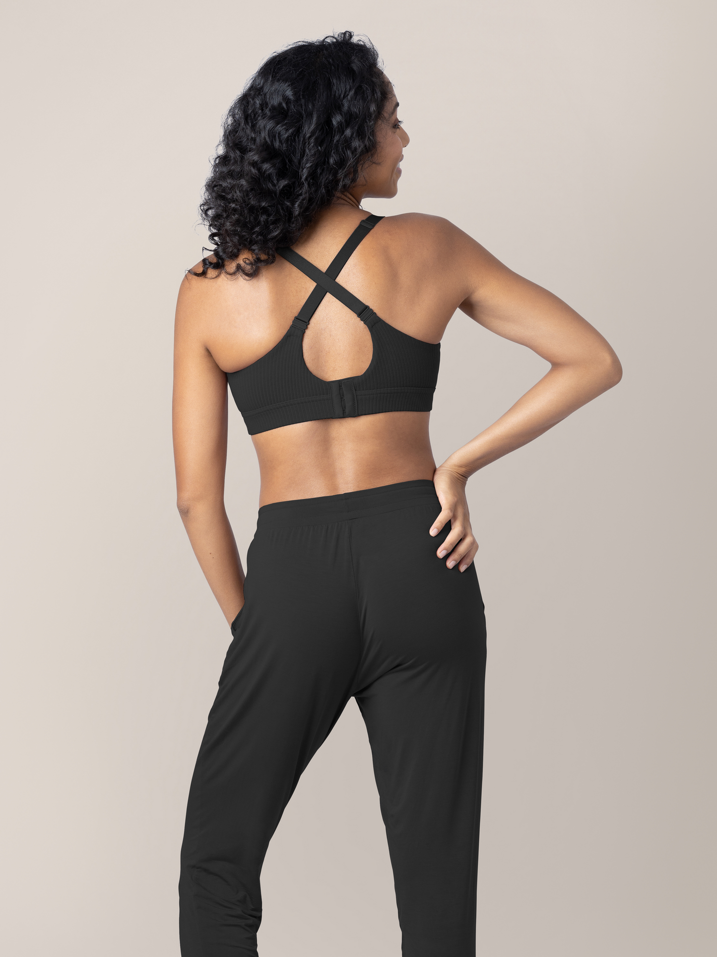 Back view of a model wearing the Ribbed Cotton Maternity & Nursing Bra | Black