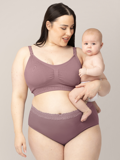 Model wearing the Simply Sublime® Nursing Bra in Twilight holding her baby on her hip. @model_info:Rachel is wearing a an X-Large Busty.