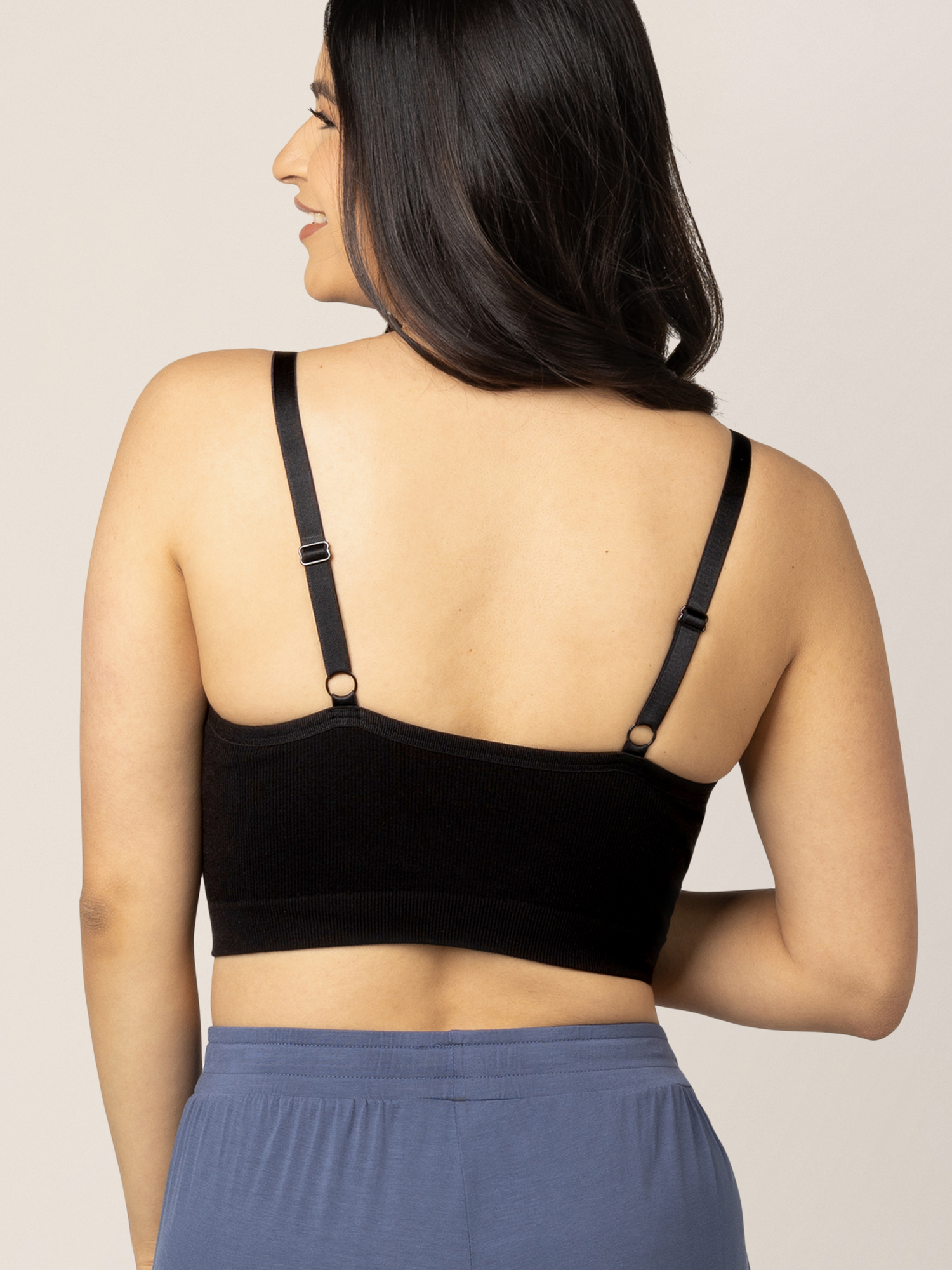 The back of a model wearing the Sublime® Bamboo Hands-Free Pumping Lounge & Sleep Bra in Black