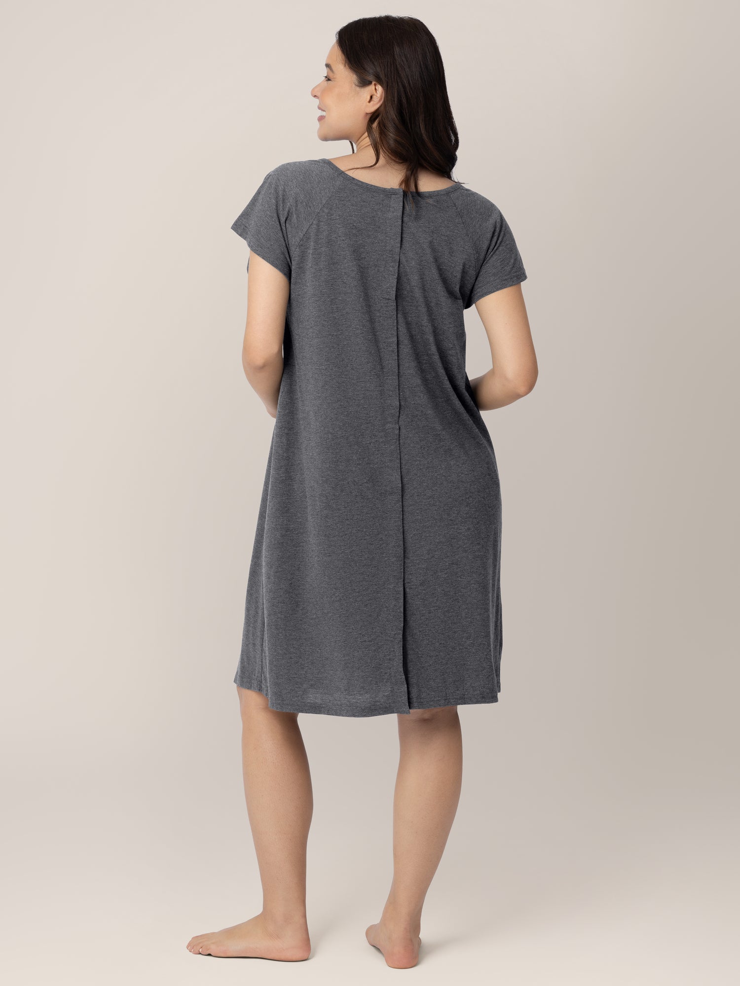 Back view of a model wearing the Universal Labor & Delivery Gown in Grey Heather