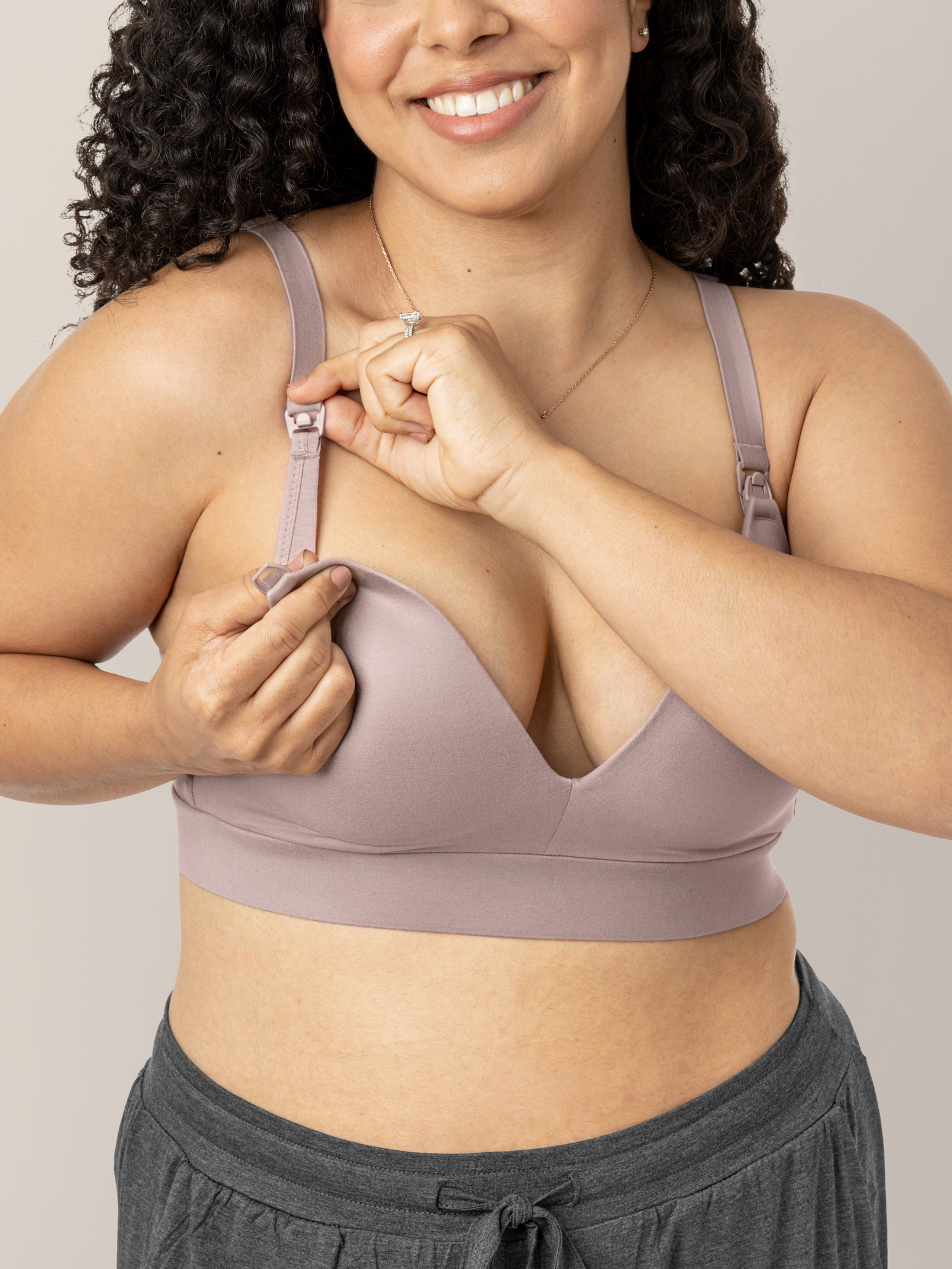 Model showing the easy clip down nursing access on the Minimalist Maternity & Nursing Bra in Lilac Stone.