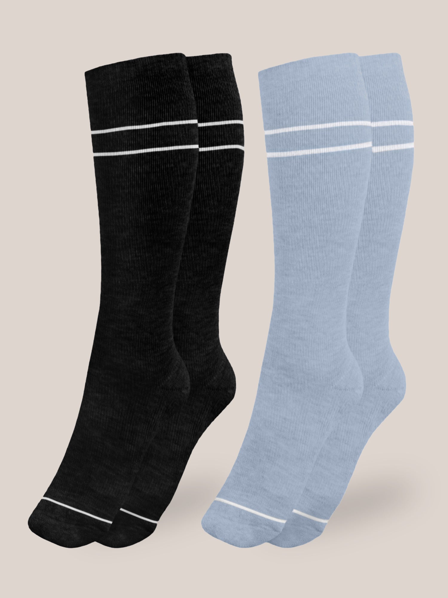 Flat lay of the Premium Maternity Compression Socks in Stone Blue and Black against an off white background.