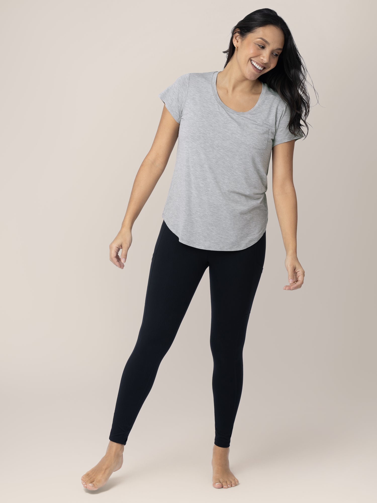 Model leaning more to one side while wearing the Everyday Maternity & Nursing T-shirt in Grey Heather