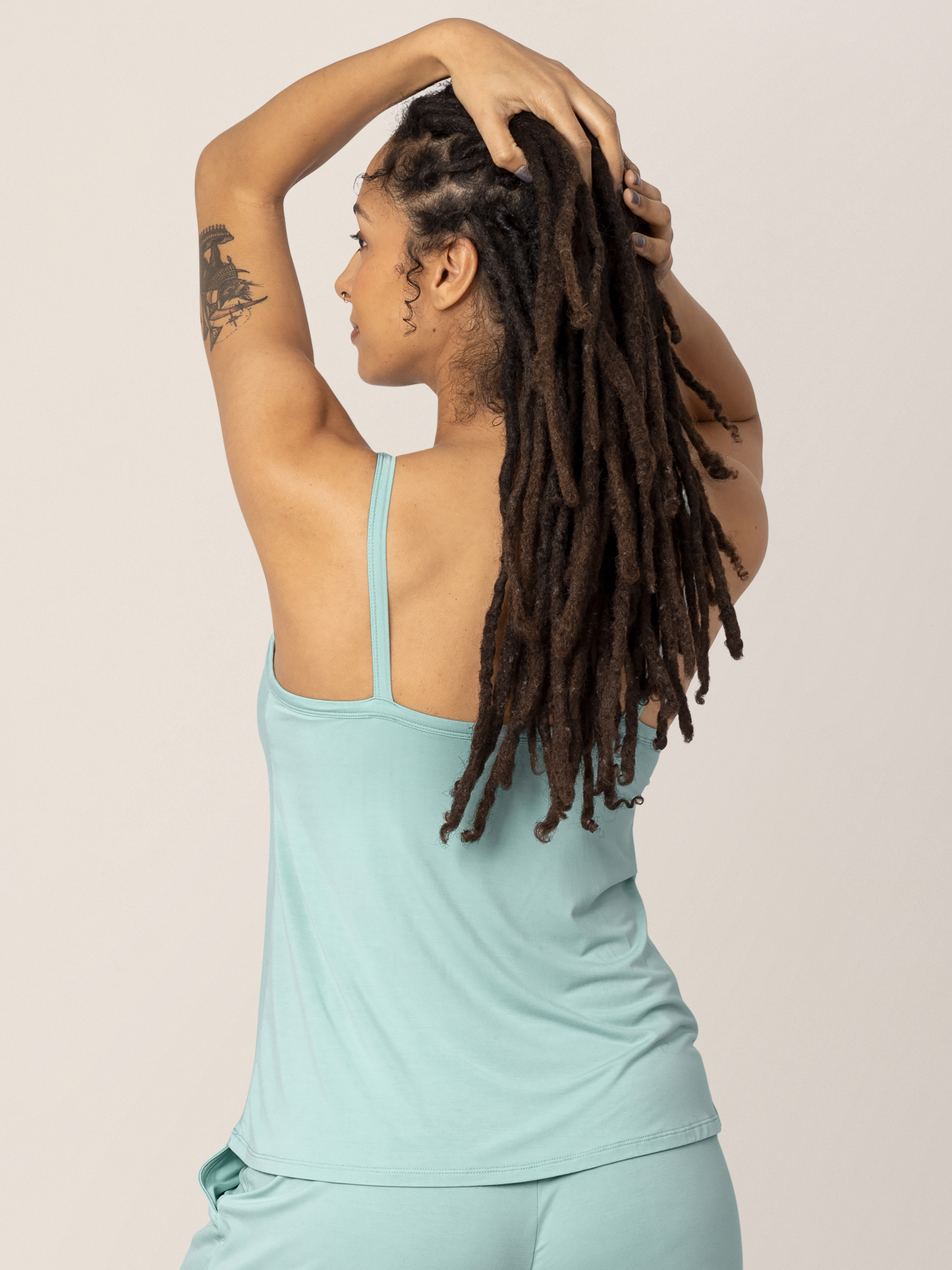 Back view of model wearing the Bamboo Lounge Around Nursing & Maternity Tank in dusty blue green, paired with the Bamboo Maternity & Postpartum Lounge Shorts in matching color