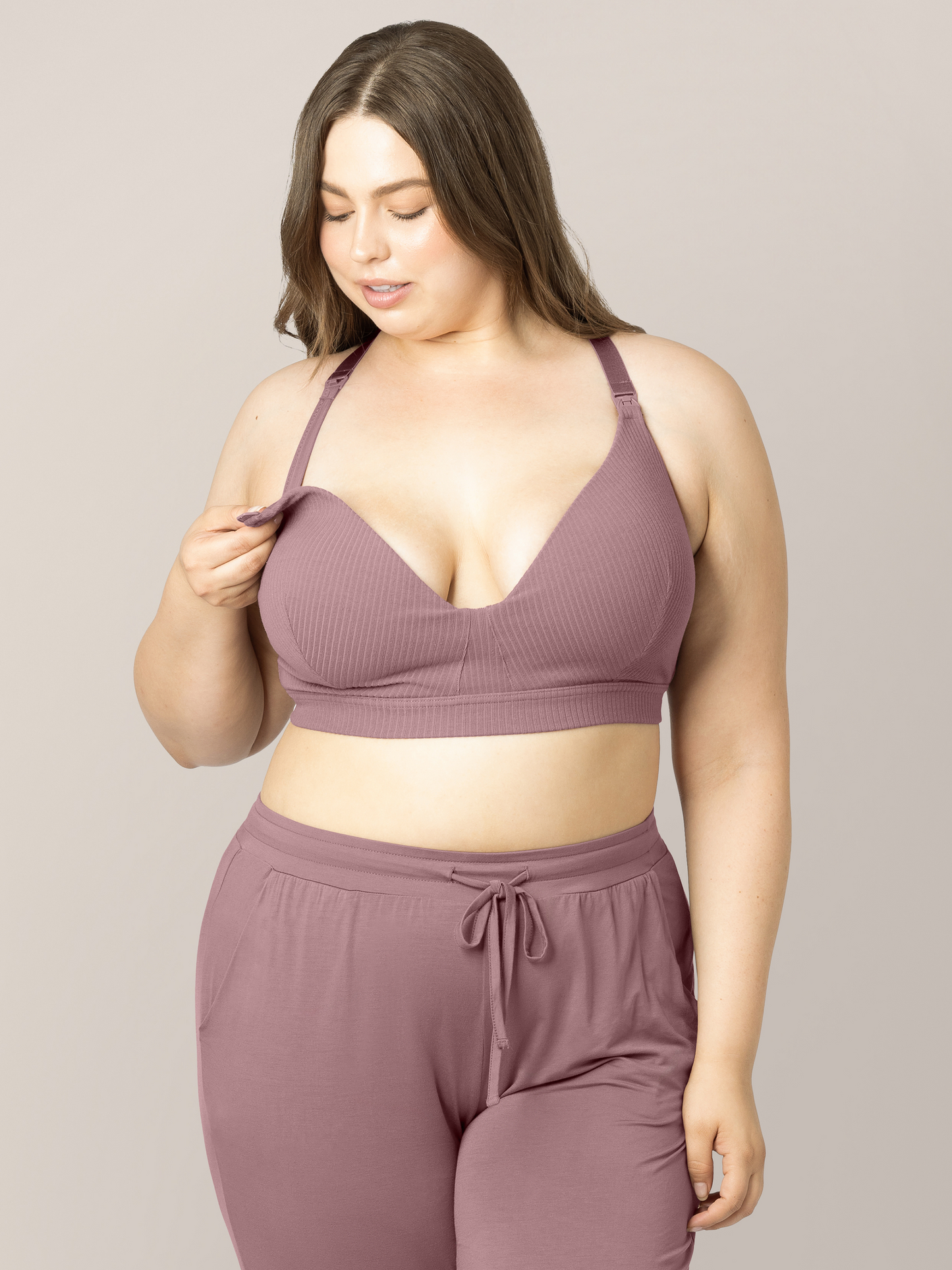 Model looking down at the RIbbed Cotton Maternity & Nursing Bra in Twilight. 