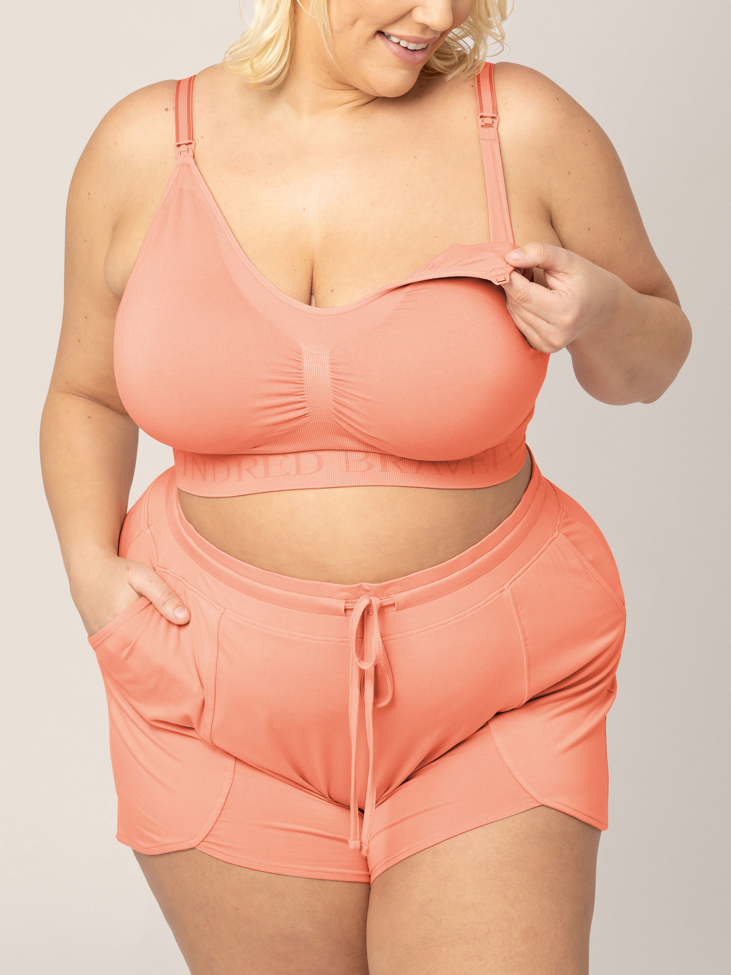 Front view of Bamboo Maternity & Postpartum Lounge Shorts in vintage coral on model