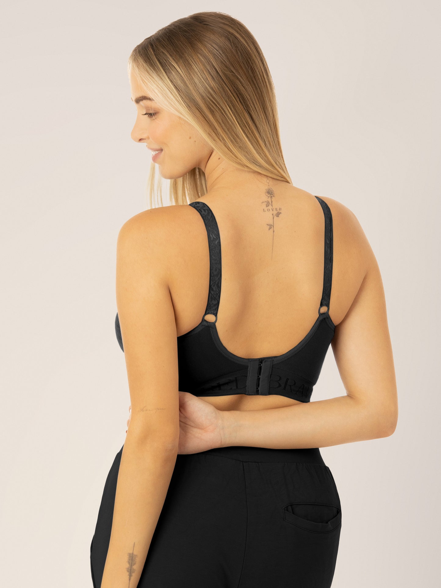 Back view of a model wearing the Sublime® Hands-Free Pumping & Nursing Bra in Black