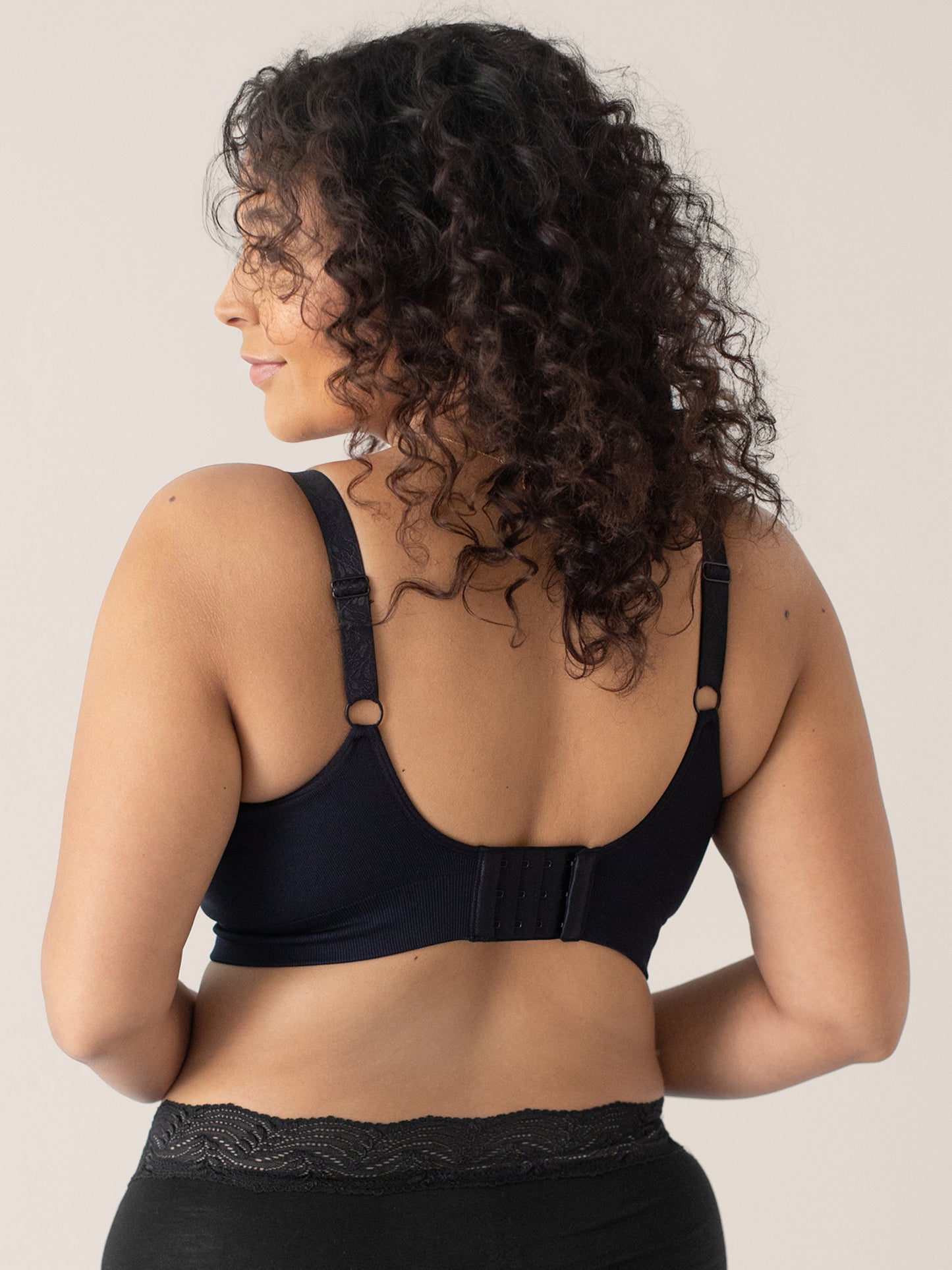 Back view of a model wearing the Nellie Sublime® Wireless Bra in Black