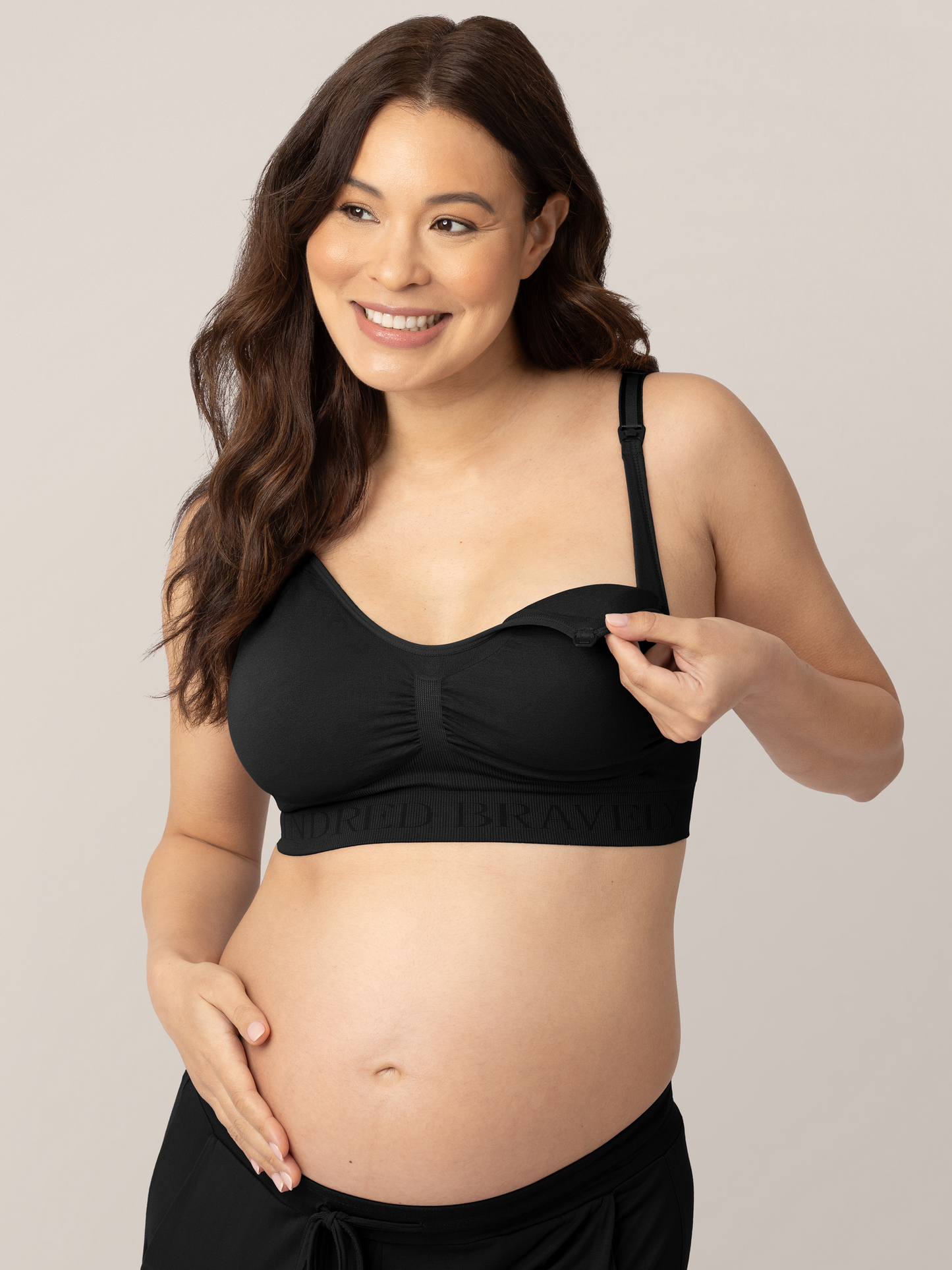 Pregnant model showing the easy clip down nursing access on the Simply Sublime® Nursing Bra in Black