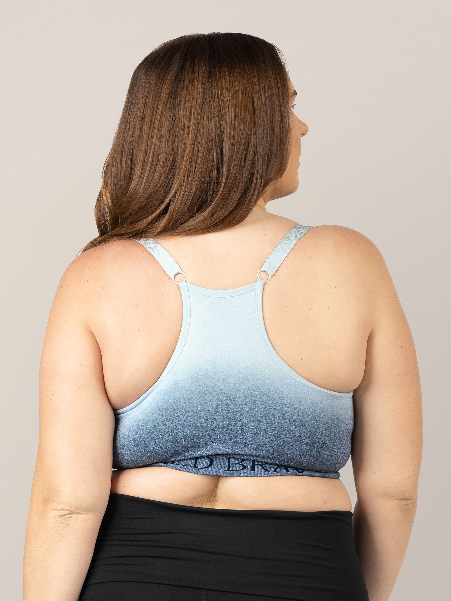 Back of a model wearing the Sublime® Nursing Sports Bra in Ombre Storm. 