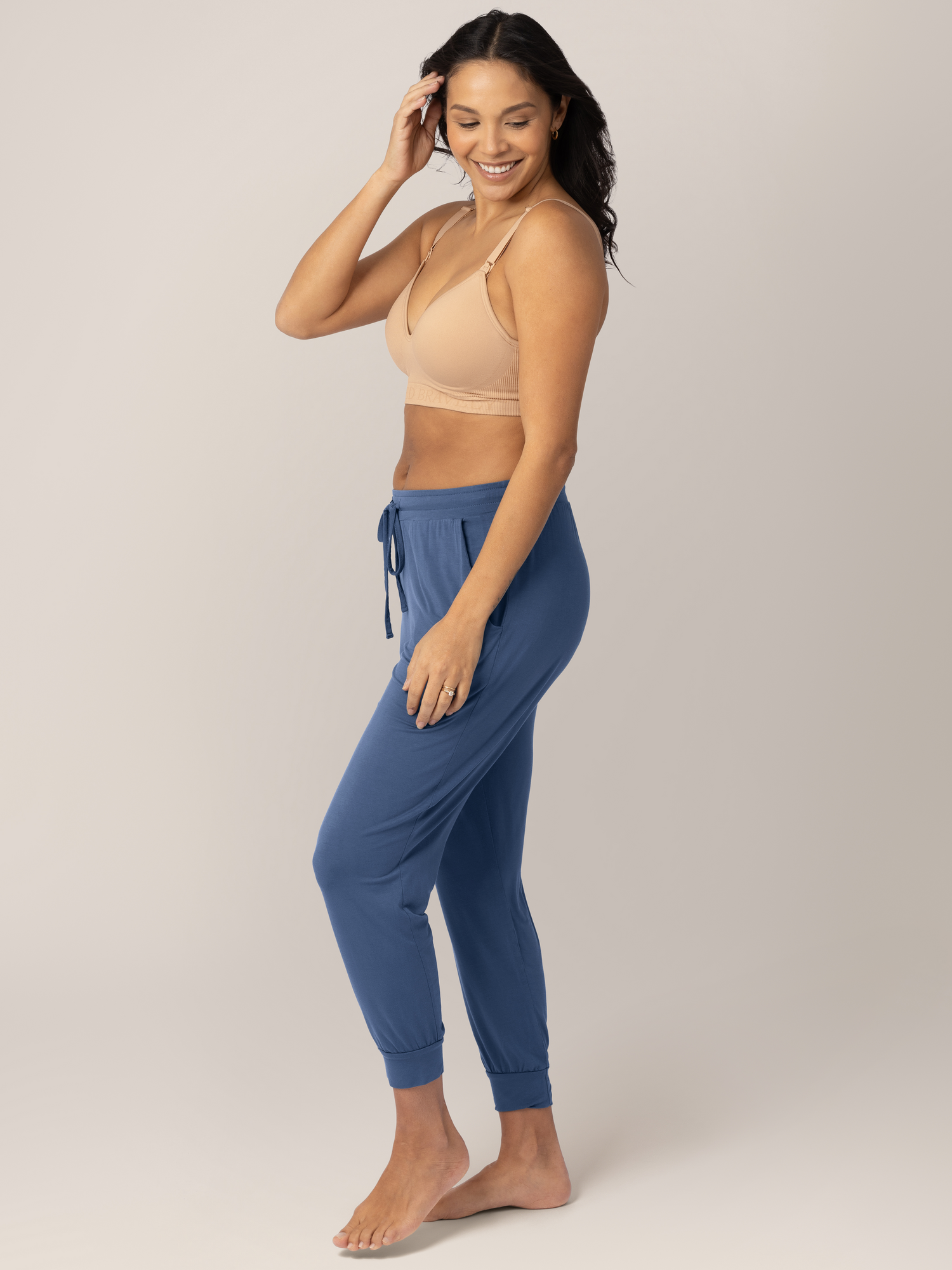 Full body view of a model wearing the Signature Sublime® Contour Maternity & Nursing Bra in Beige 