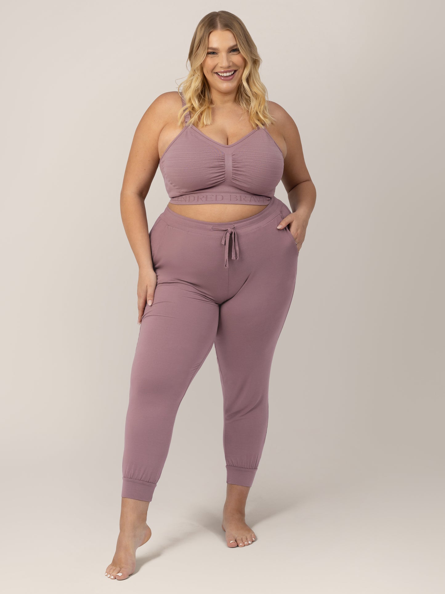 Busty model wearing the Sublime® Hands-Free Pumping & Nursing Bra in Twilight 