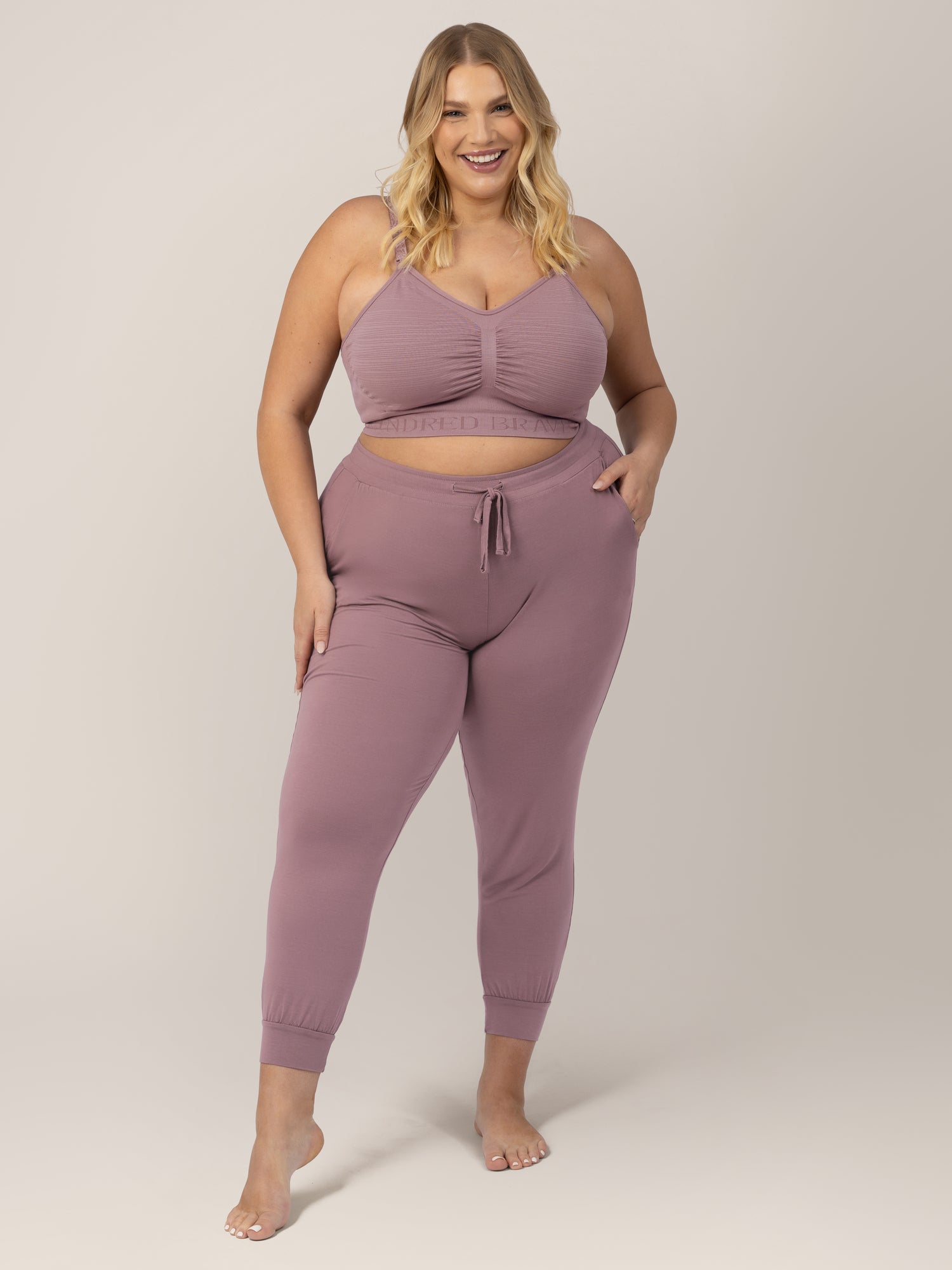 Busty model wearing the Sublime® Hands-Free Pumping & Nursing Bra in Twilight 