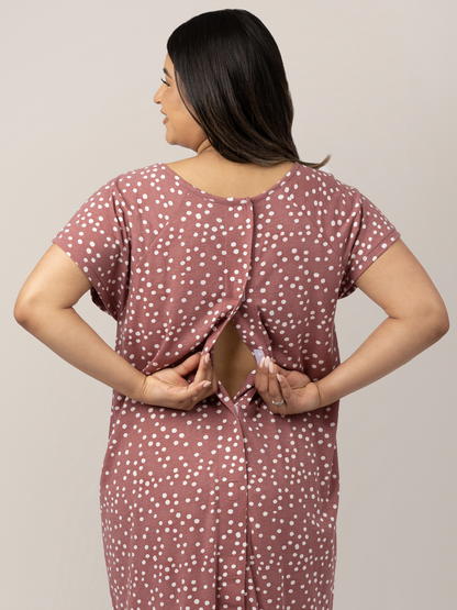 Back view of a pregnant model showing the easy epidural access on the Universal Labor & Delivery Gown in Rosewood Polka Dot