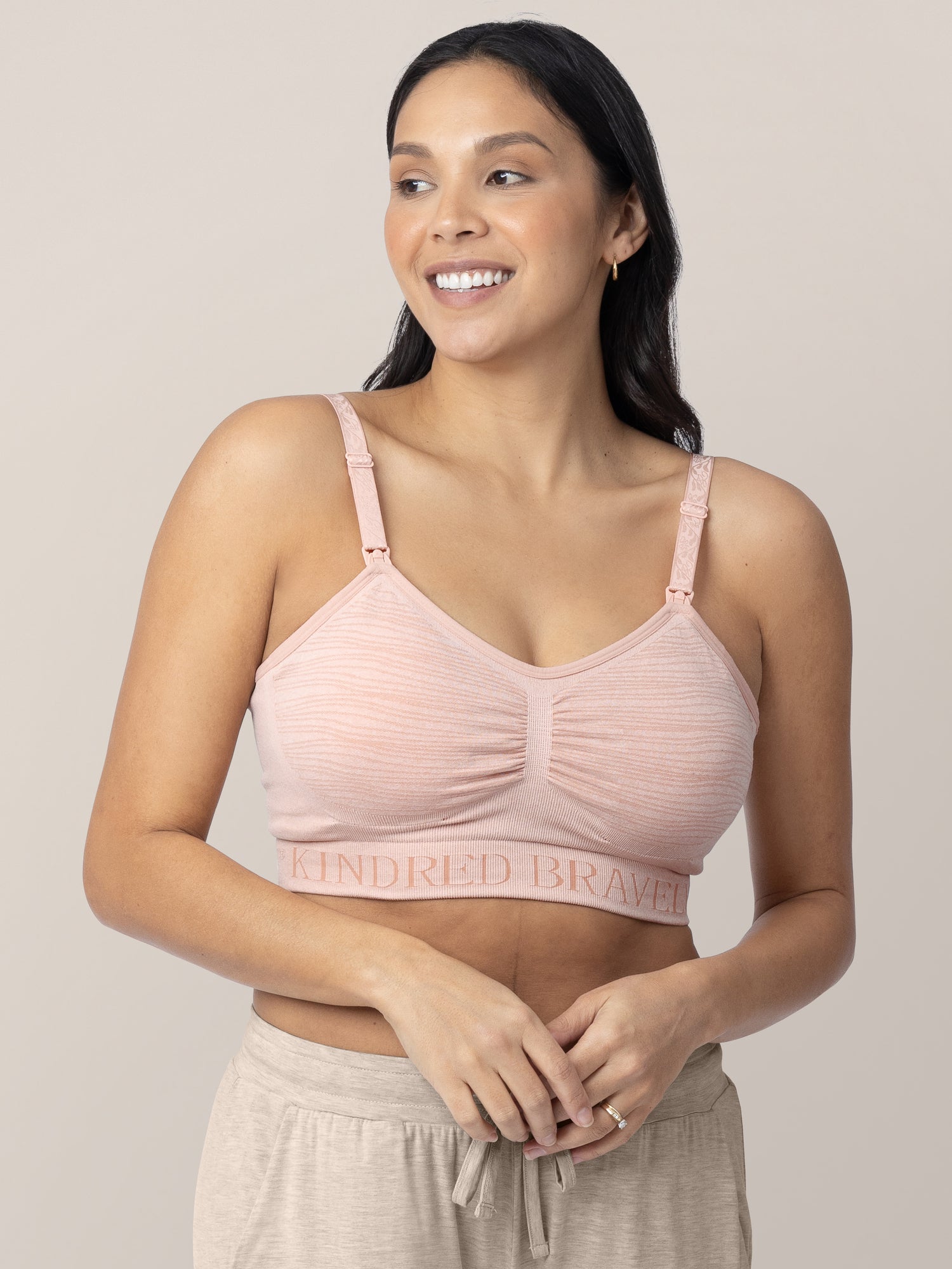 Close up of a model wearing the Sublime® Hands-Free Pumping & Nursing Bra in Pink Heather